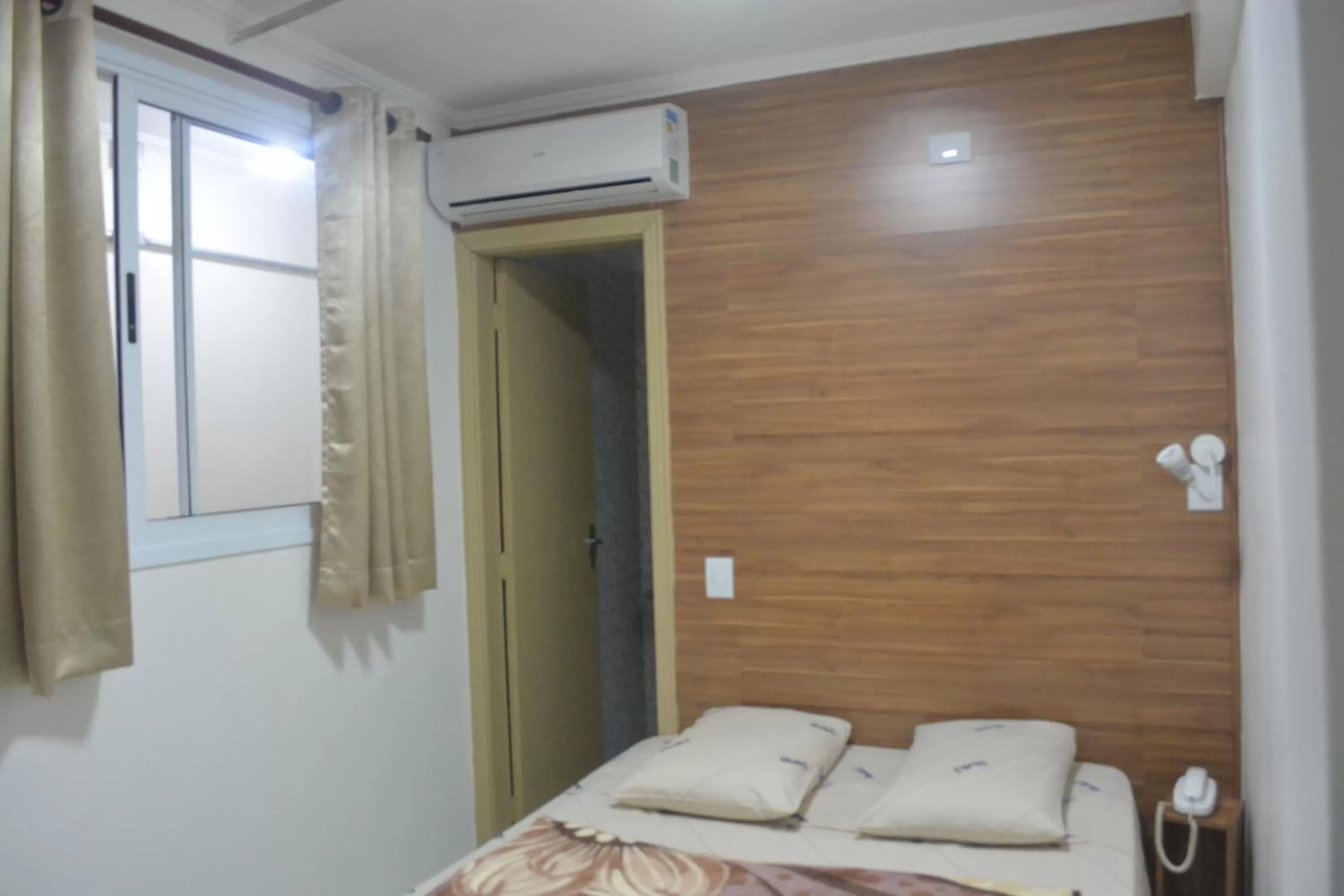 Bed in New Point Hotel