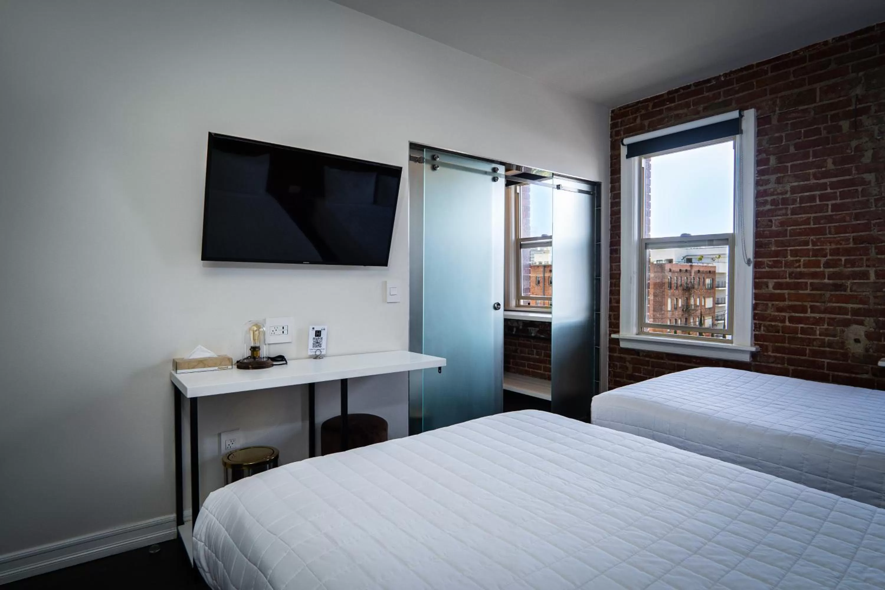 Bed in H by H Hospitality