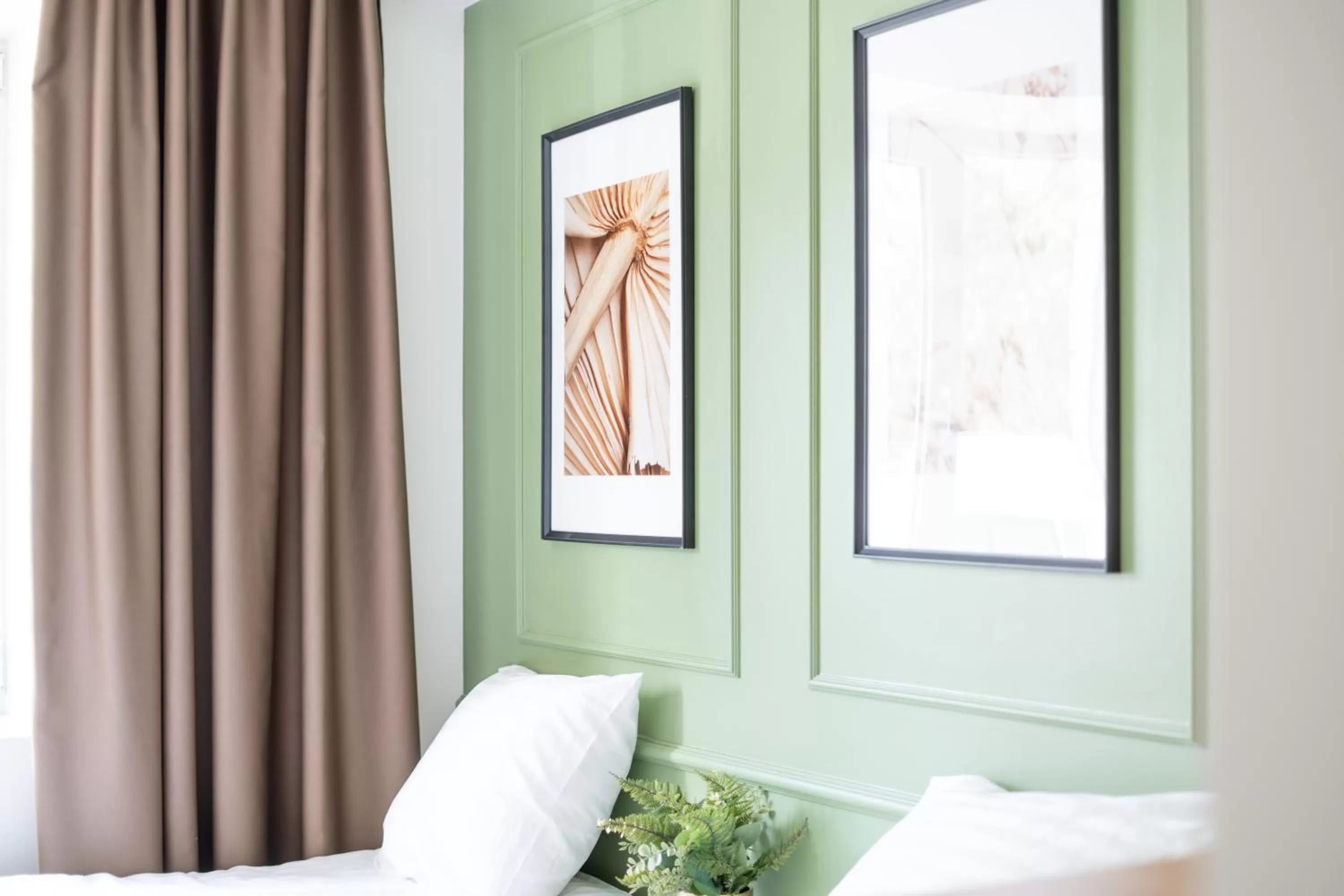 Decorative detail, Bed in Oasis Airport Studios by RevalHome