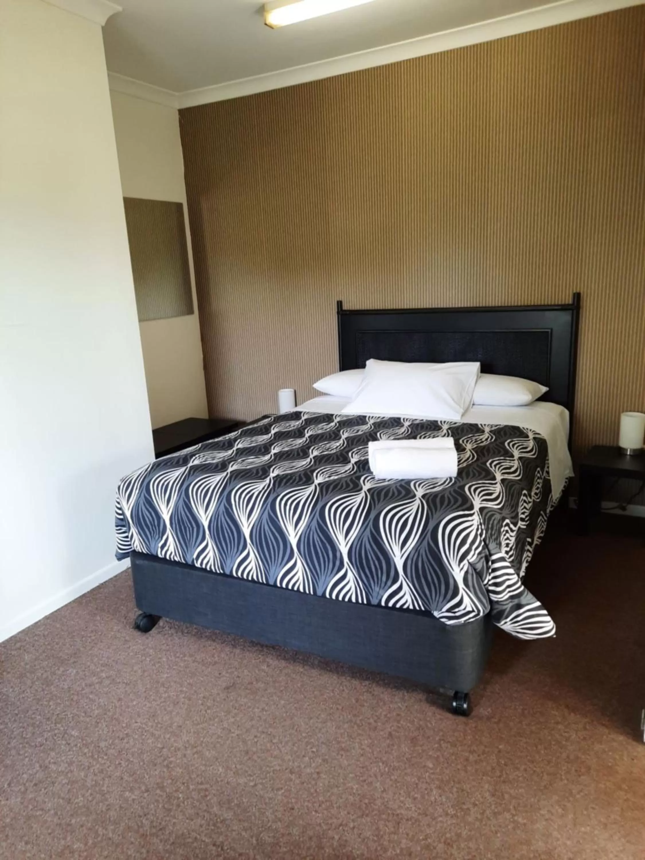 Bed in Flying Spur Motel