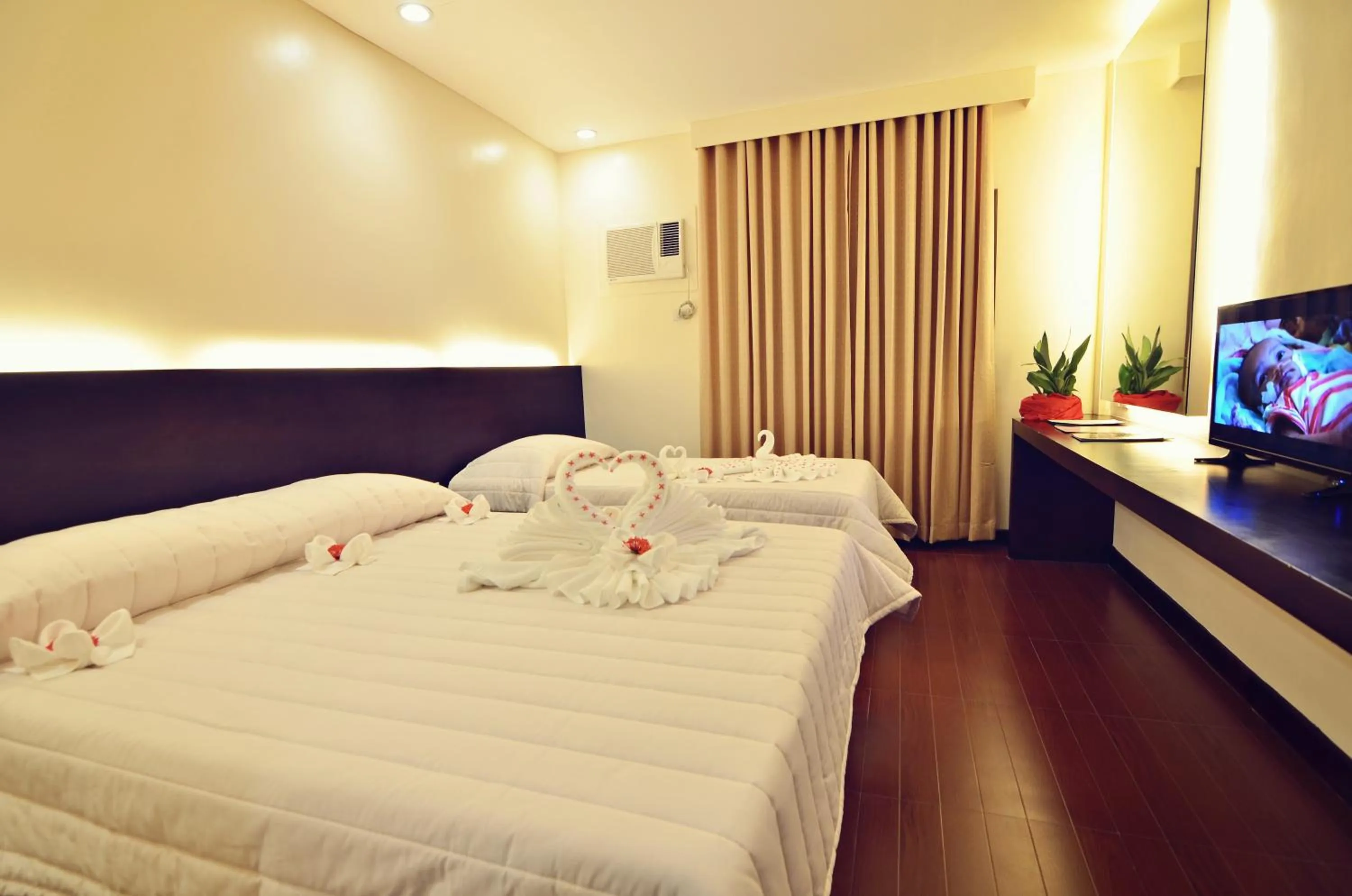 Bed in Citystate Asturias Hotel Palawan