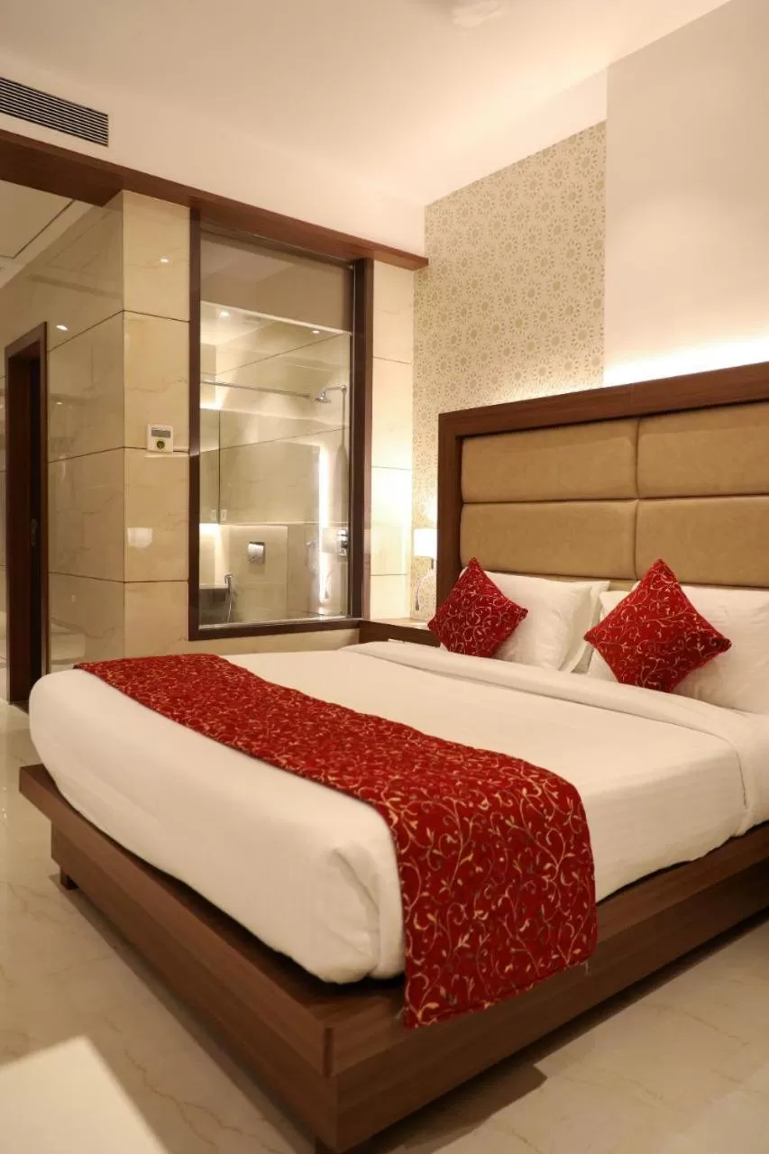 Bed in Hotel Gurudev Grand