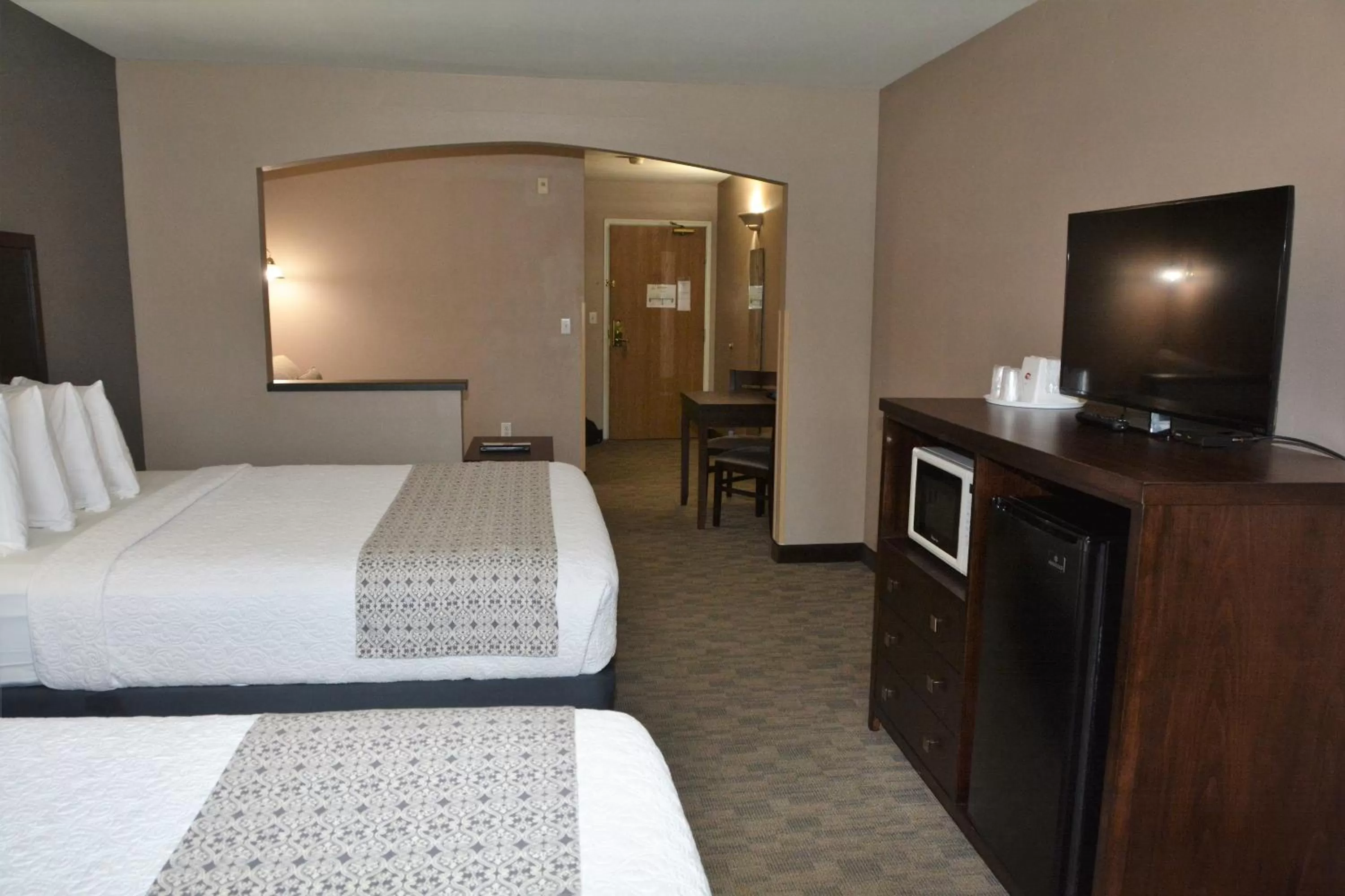 Bed in FairBridge Inn & Suites DuPont