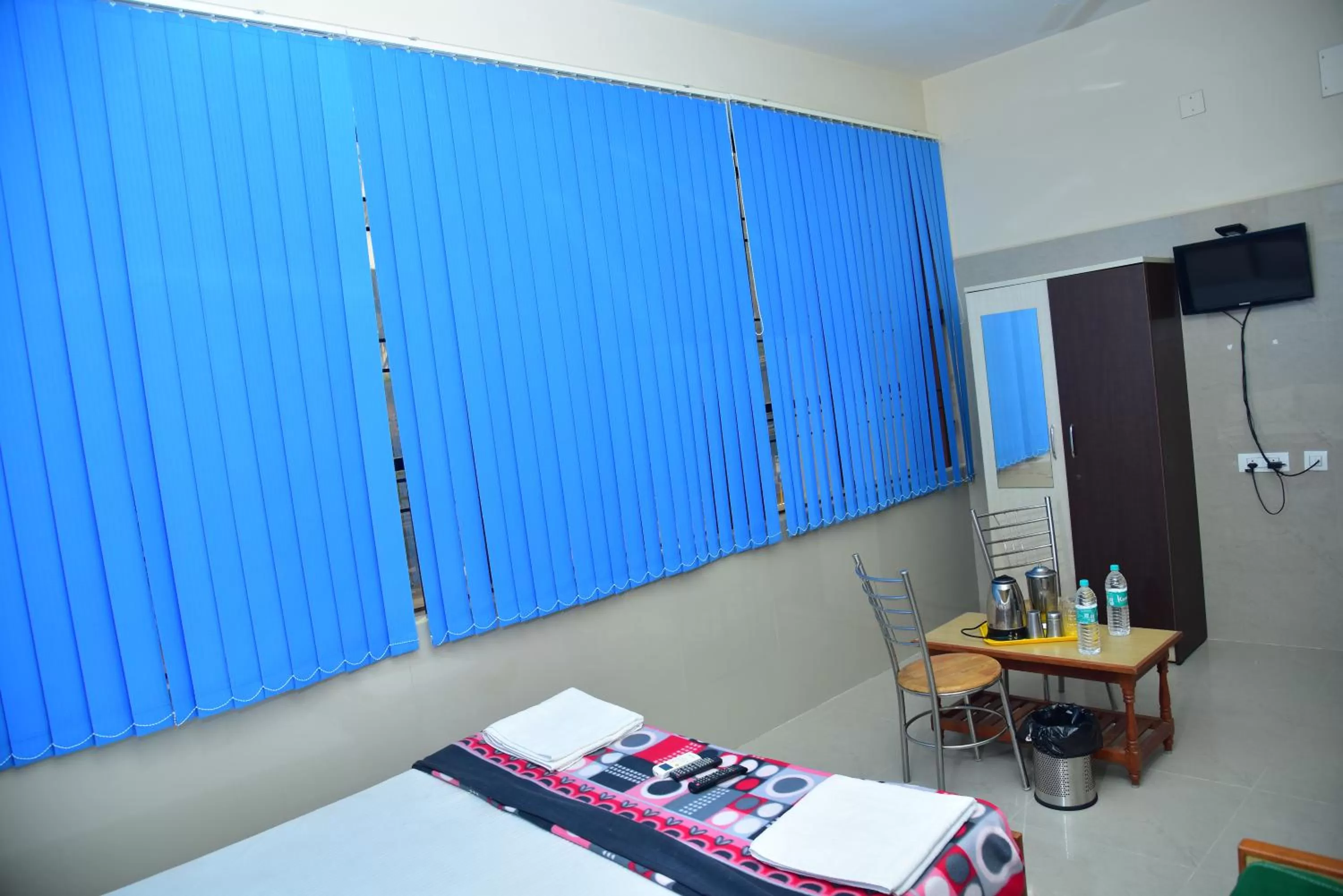 Photo of the whole room, Bed in SGRT Residency