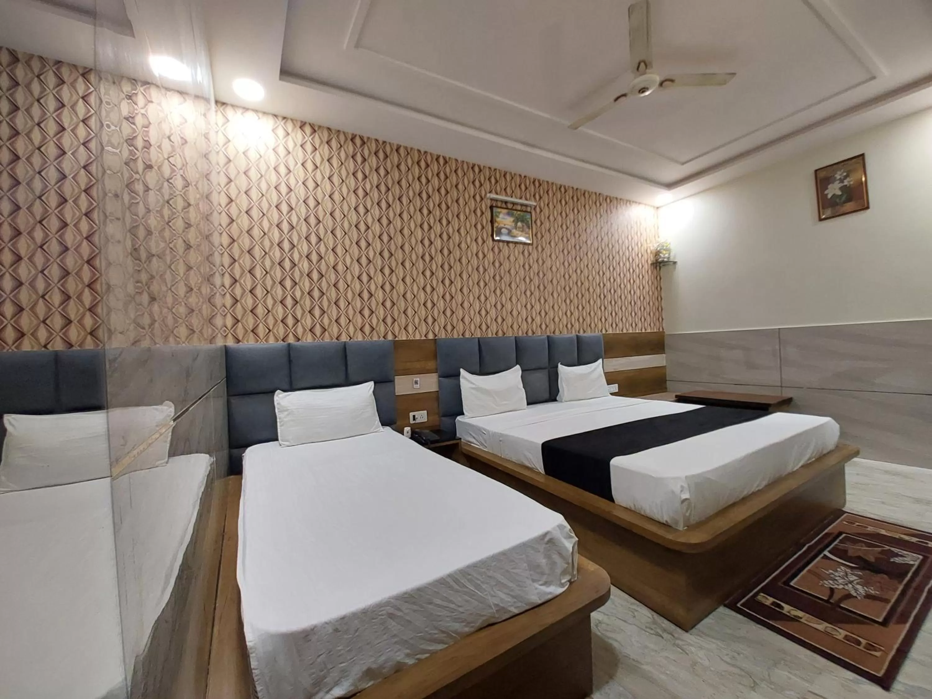 Photo of the whole room, Bed in Taj Nice Point Manage by Taj Sunrise Group