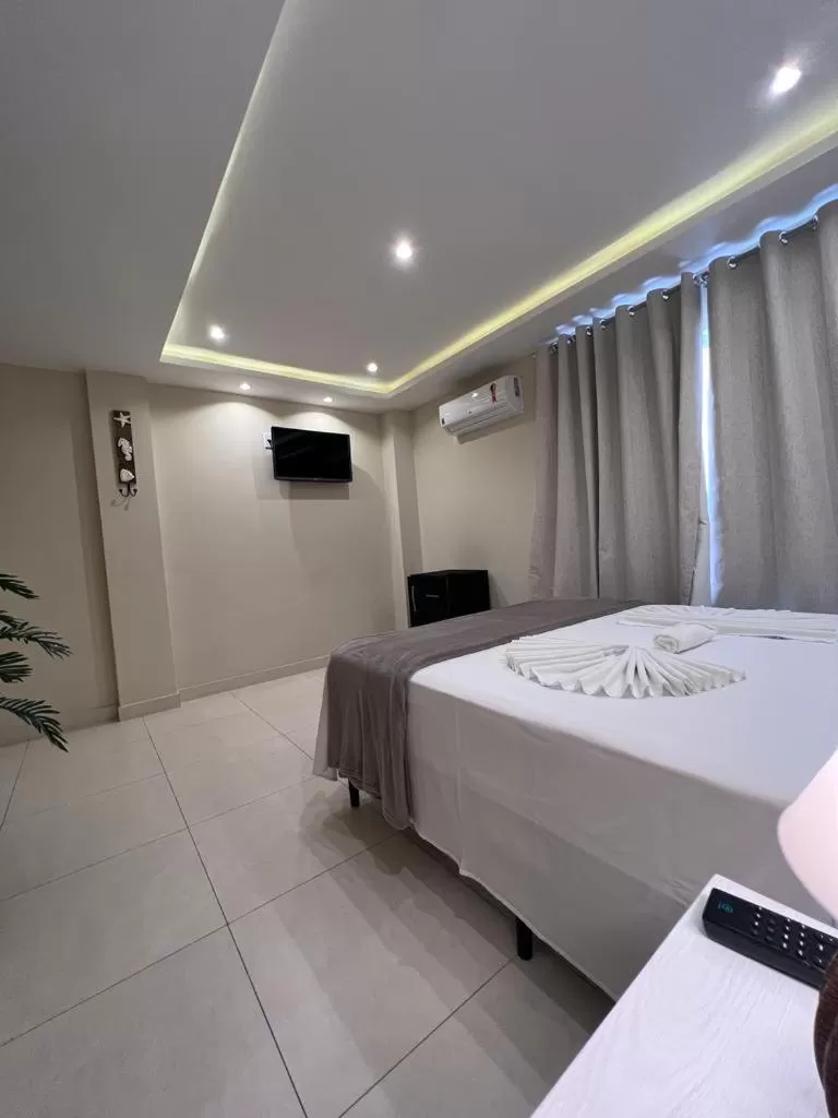 Bed in Pousada Arraial Tropical