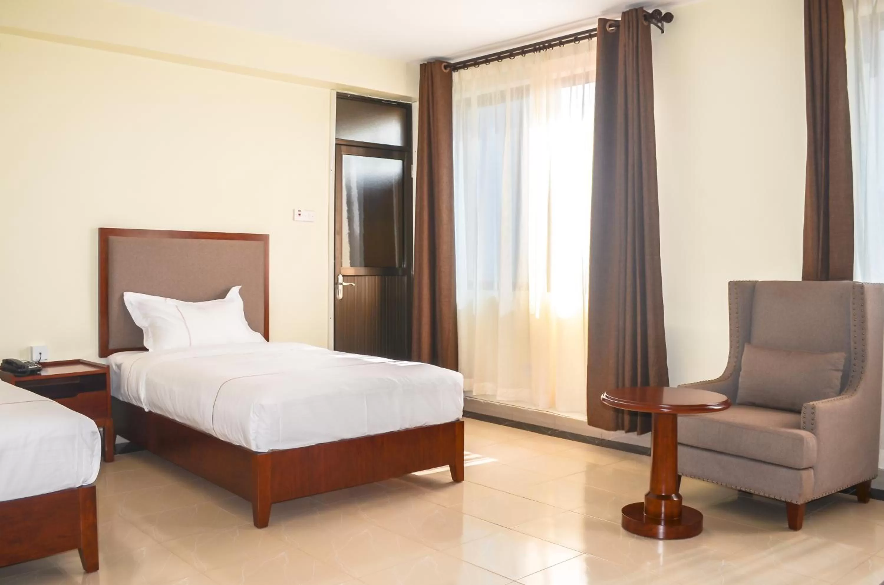 Seating area, Bed in Igar Plaza Hotel