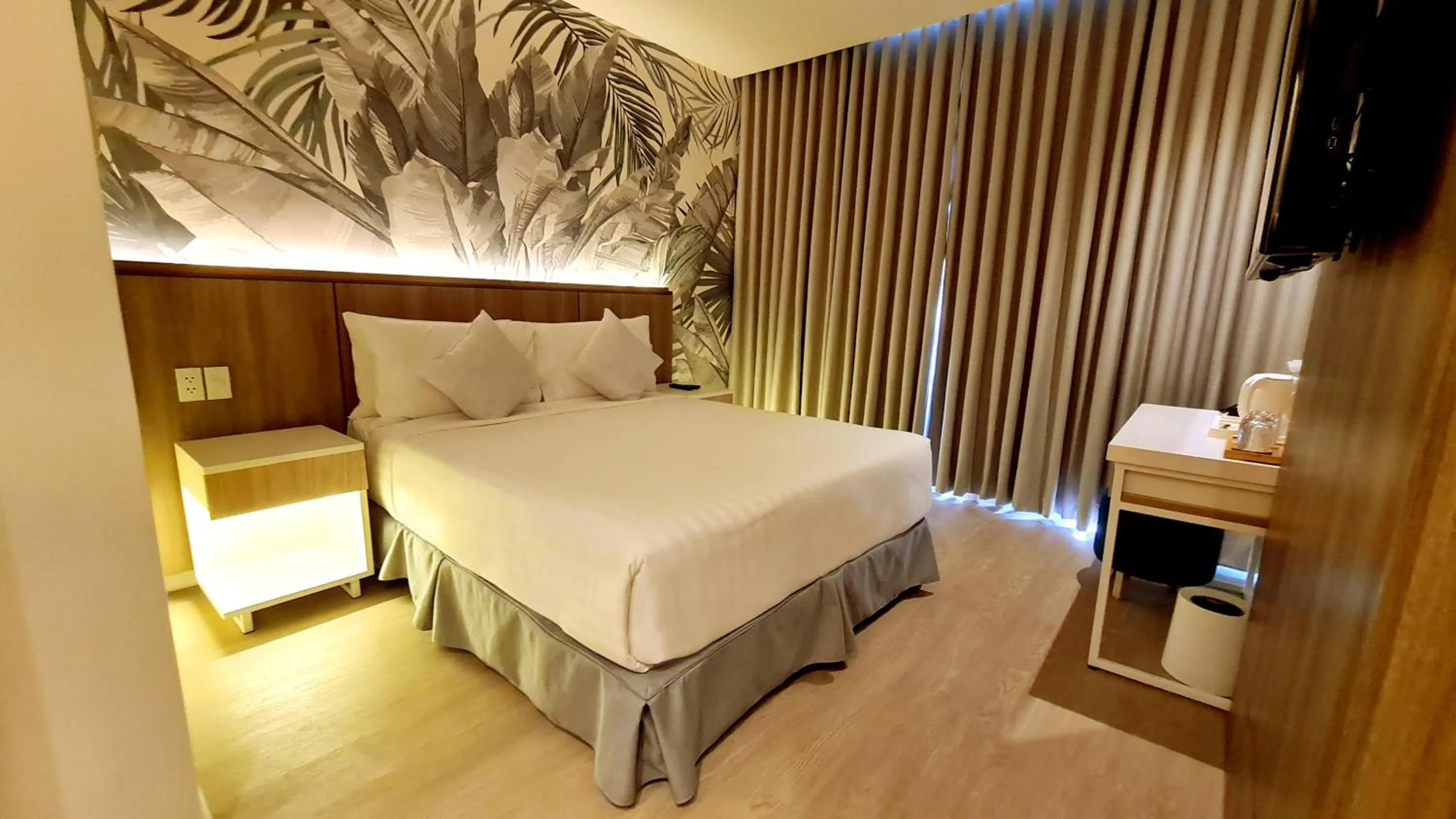 Bed in Harolds Hotel Quezon City