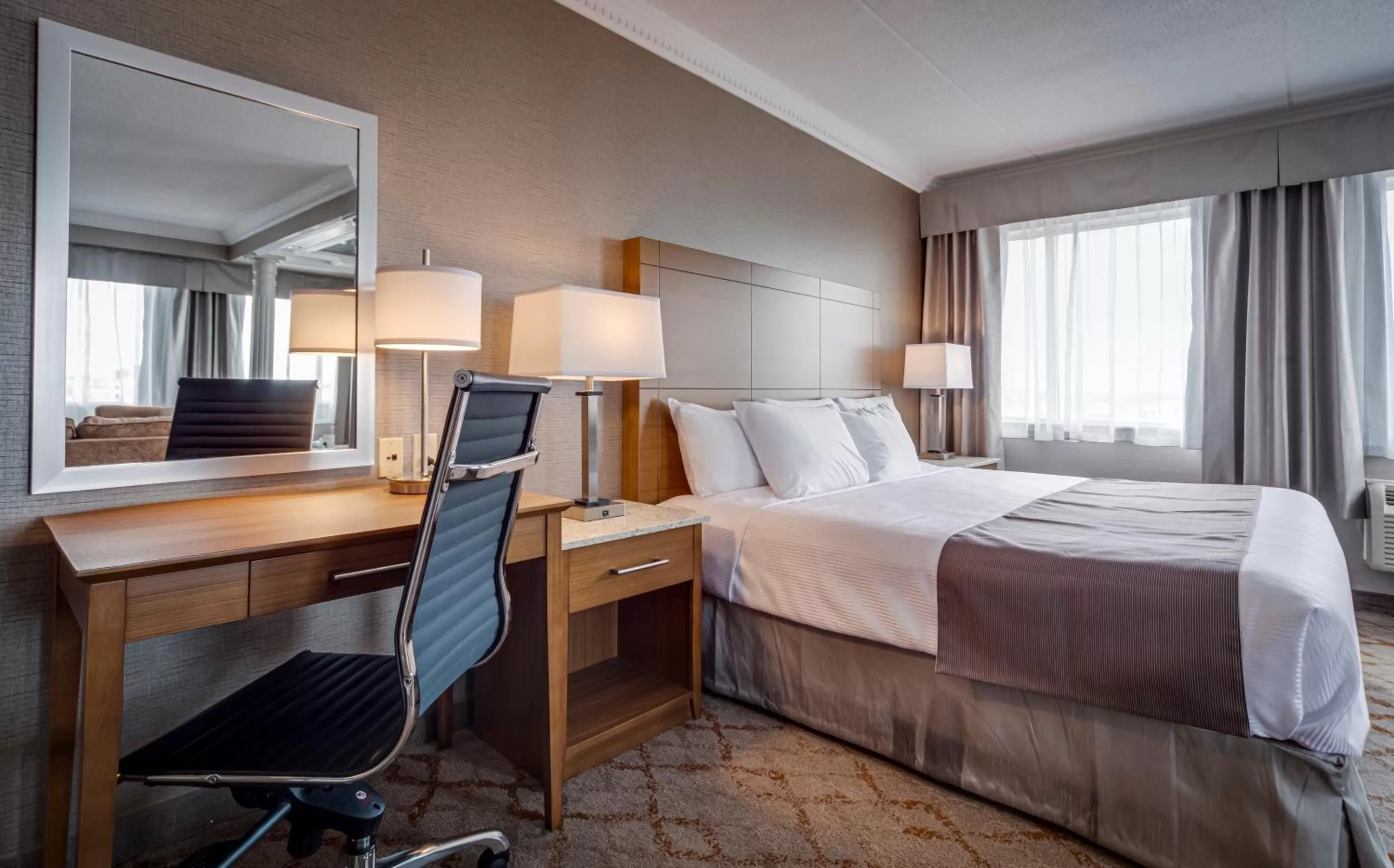 Bed in Monte Carlo Inn Vaughan Suites