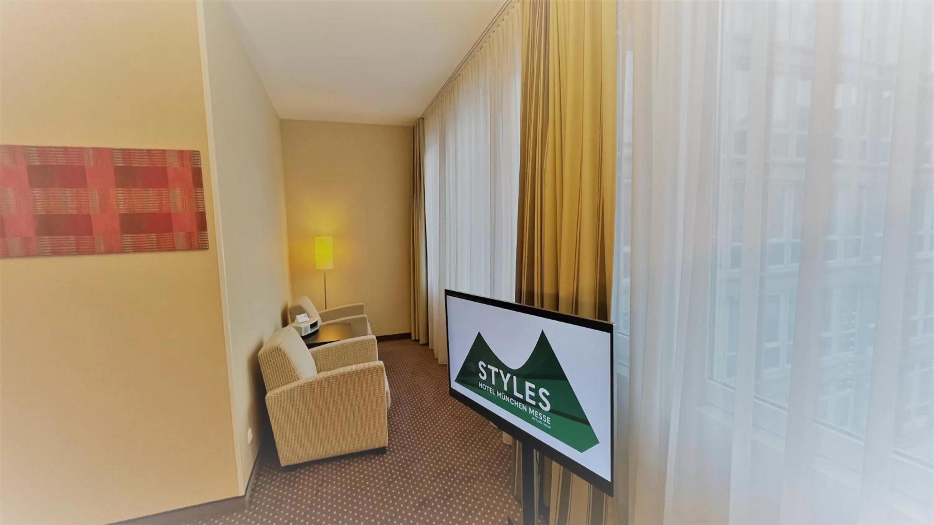 View (from property/room), TV/Entertainment Center in Styles Hotel München Messe