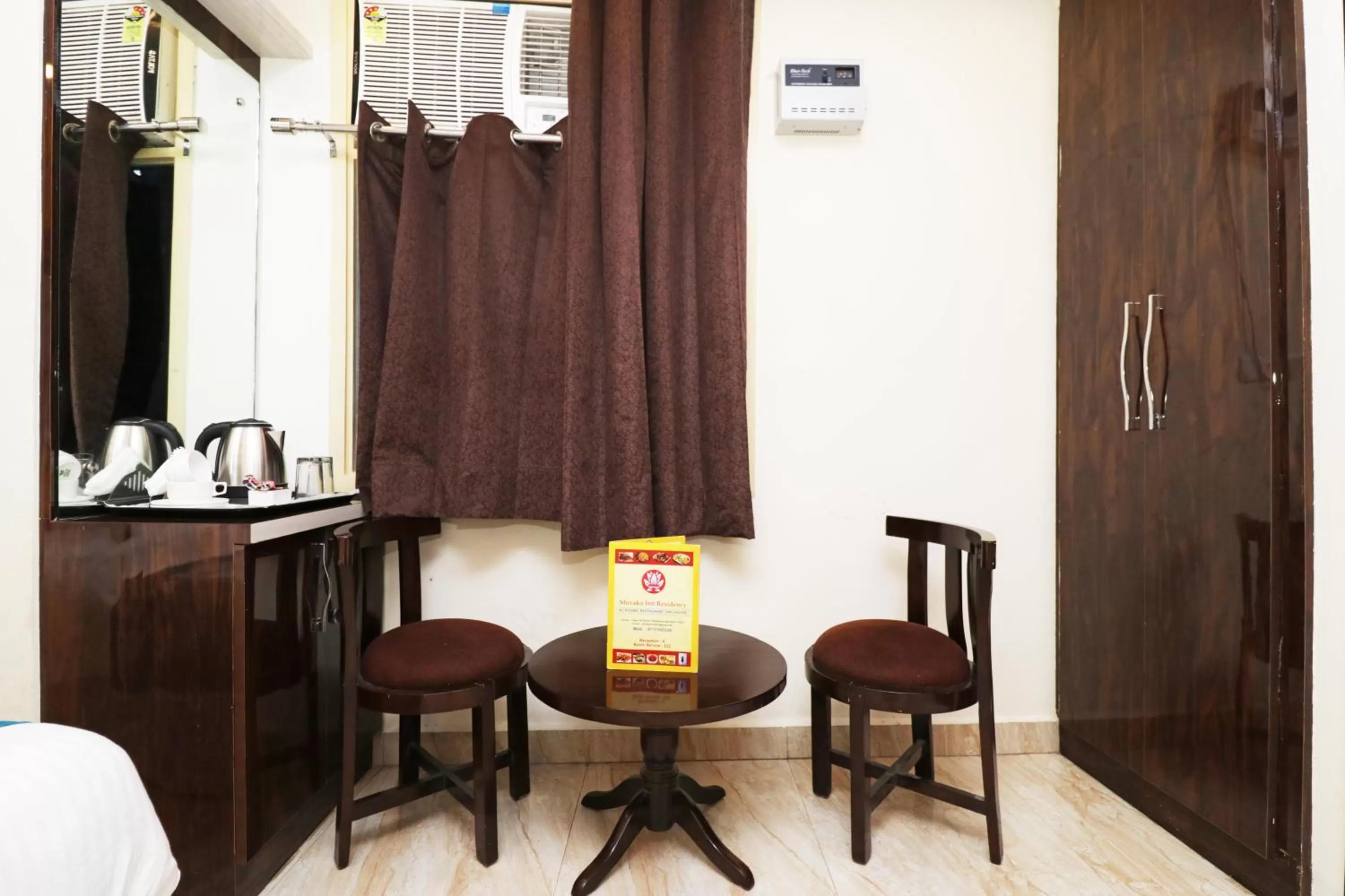 Seating area in Airport Hotel Shivaka Inn