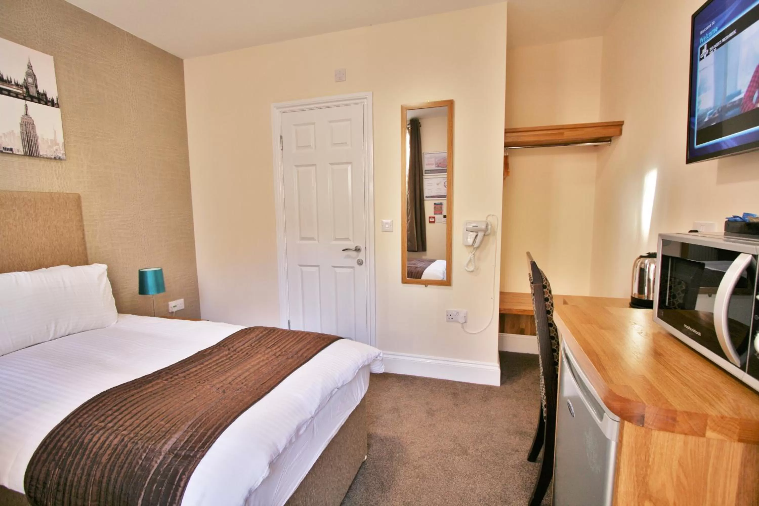Bed in New County Hotel & Serviced Apartments by RoomsBooked
