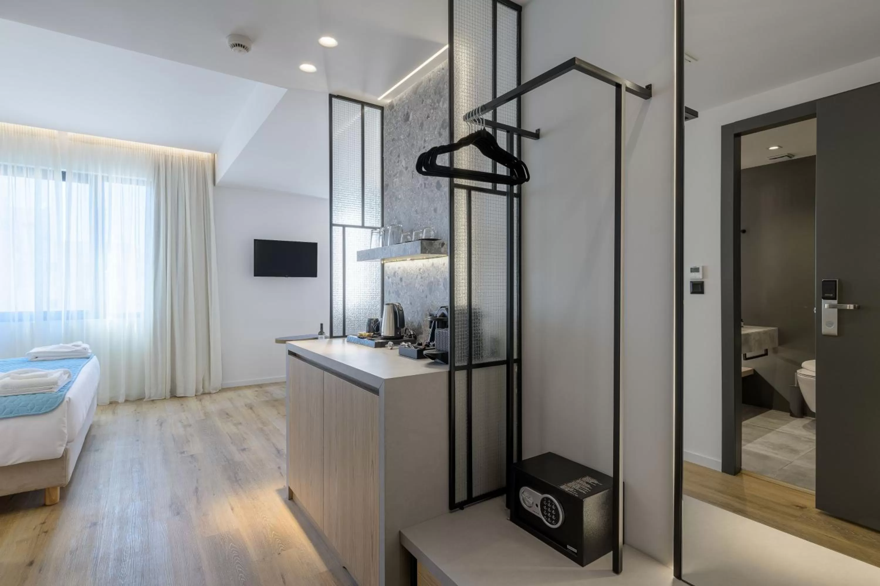 Bed in Acropolis Magenta Luxury Suites