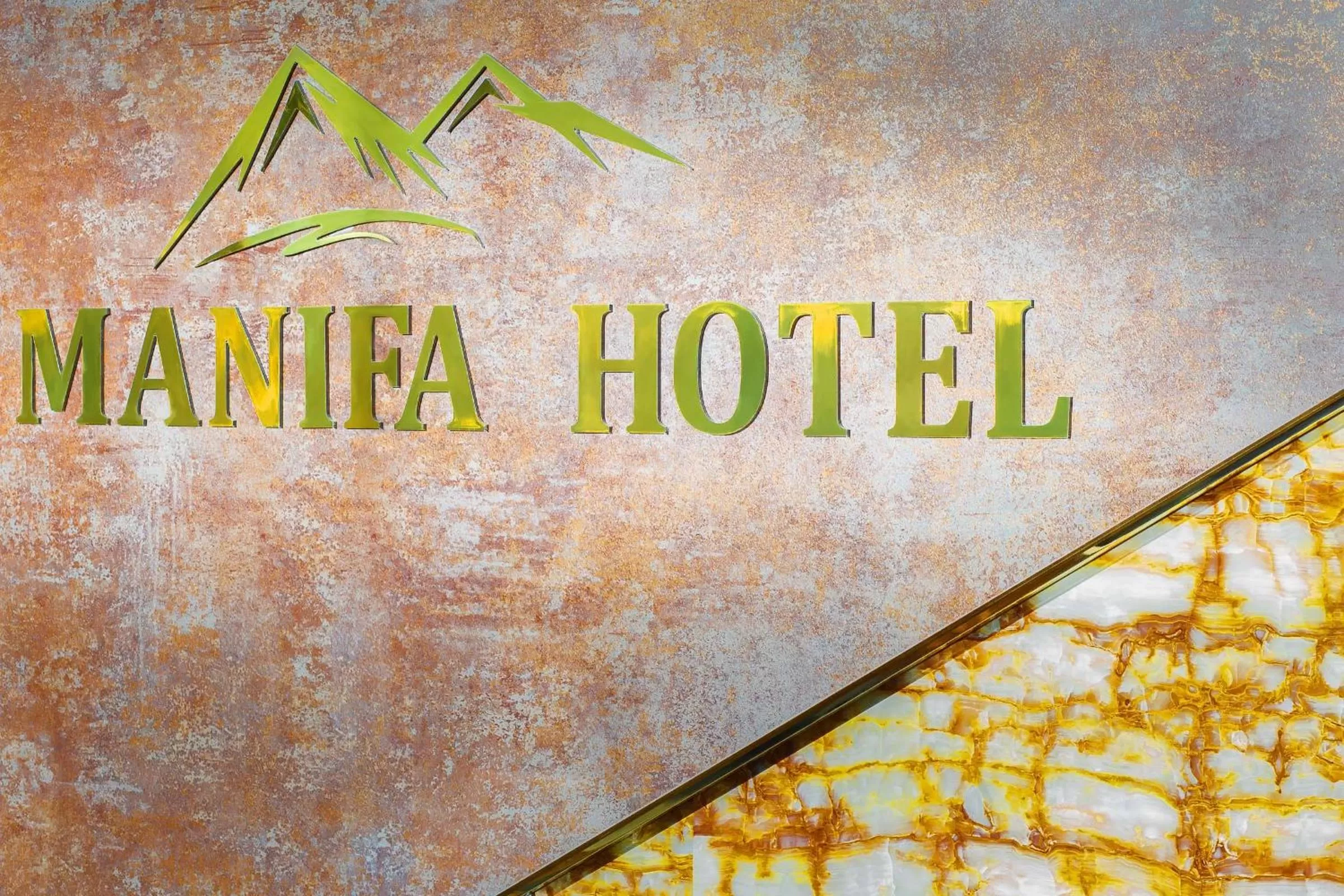 Property logo or sign in Manifa Hotel