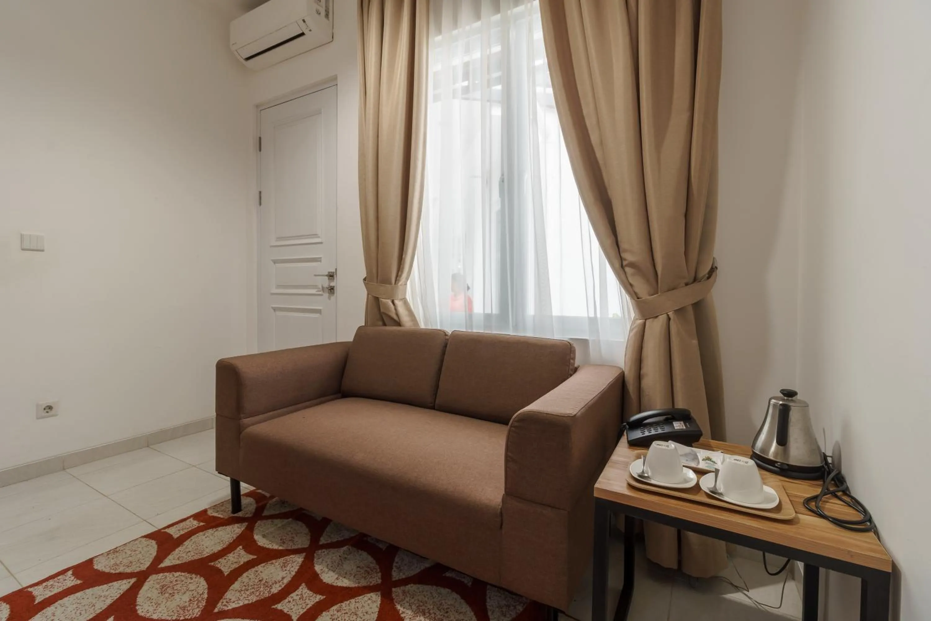 Bedroom in RedDoorz Plus near Exit Toll Puncak 2