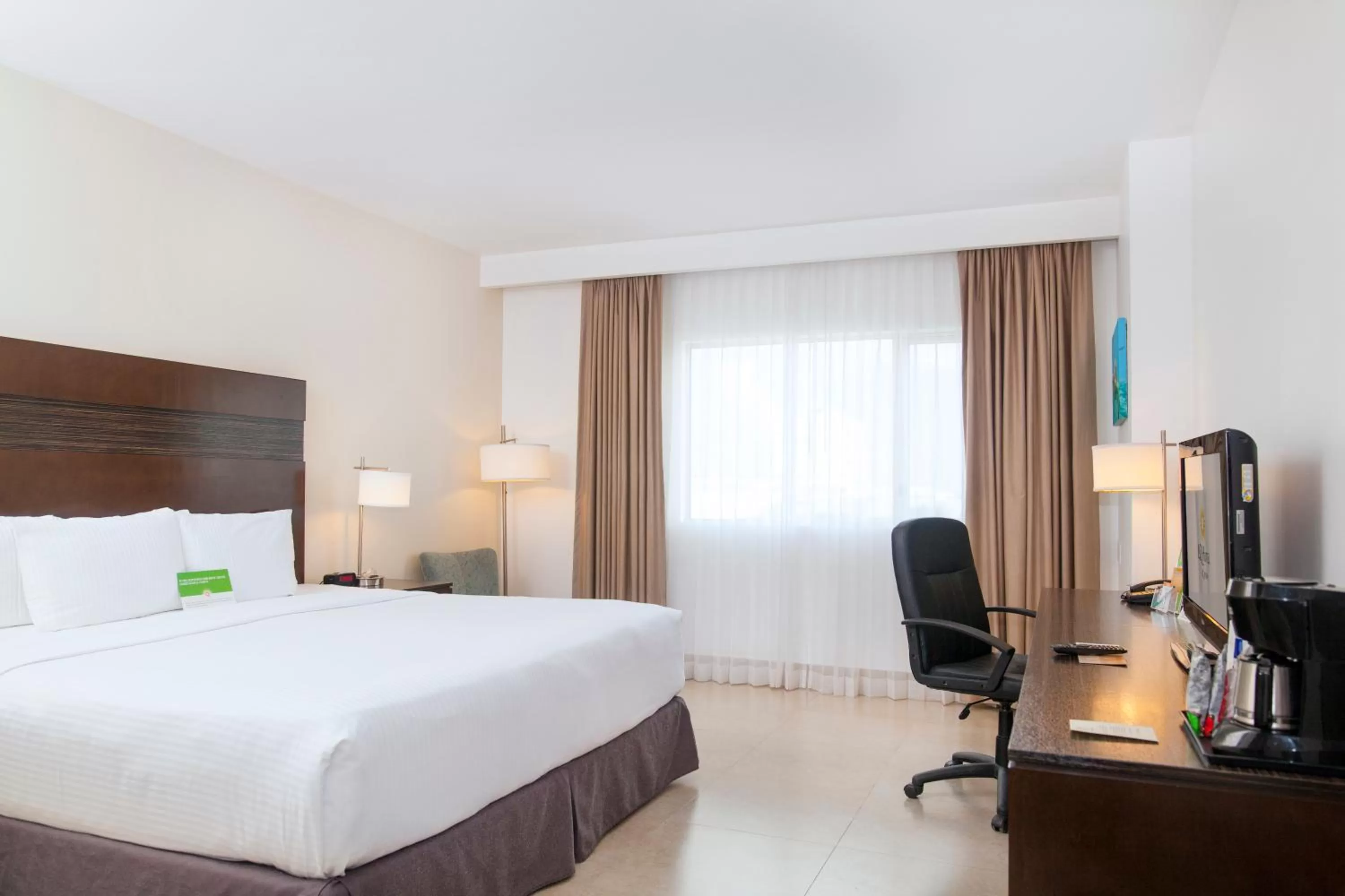 Photo of the whole room, Bed in Wyndham Garden Cancun Downtown