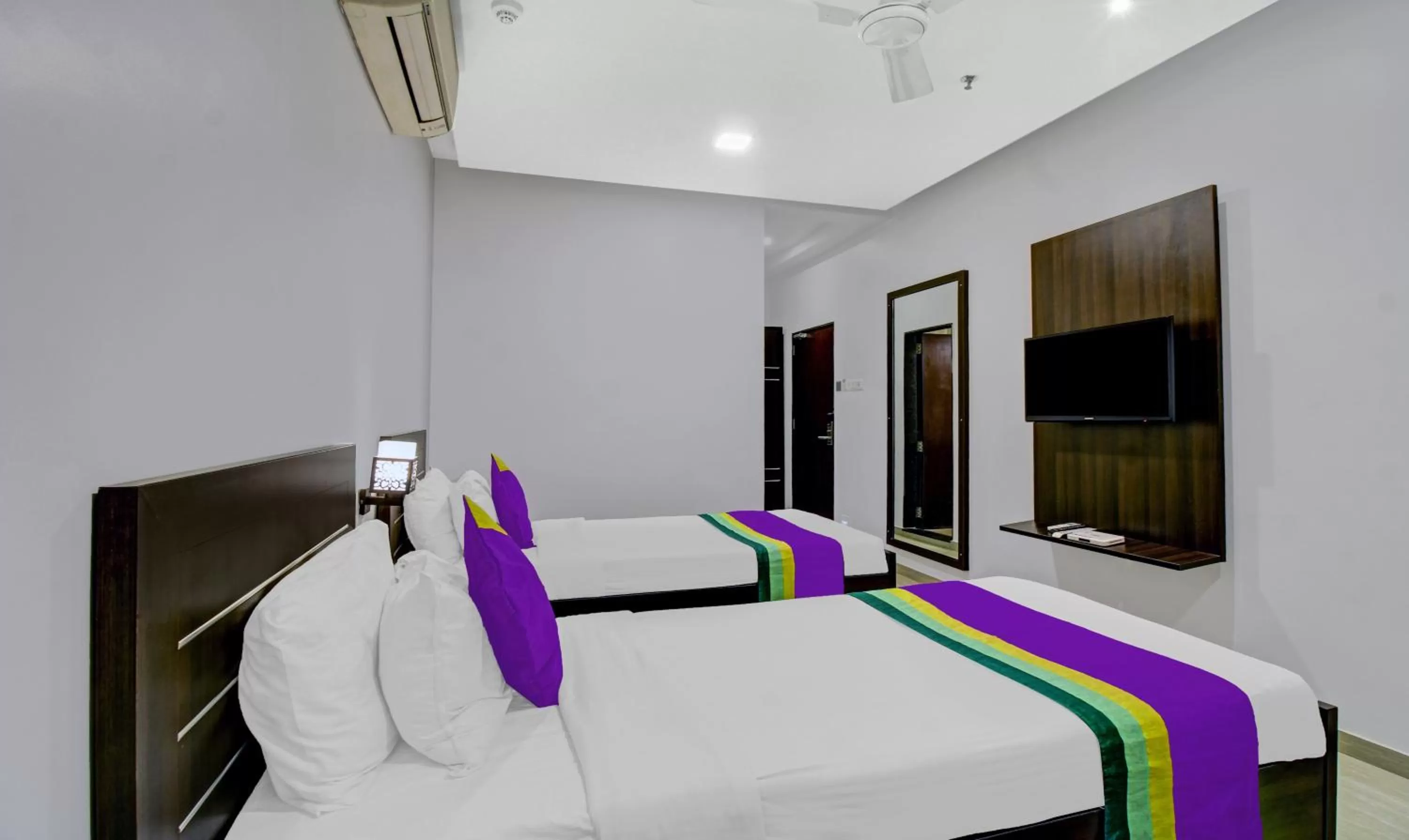 Bedroom, Bed in Treebo Premium Brijinn