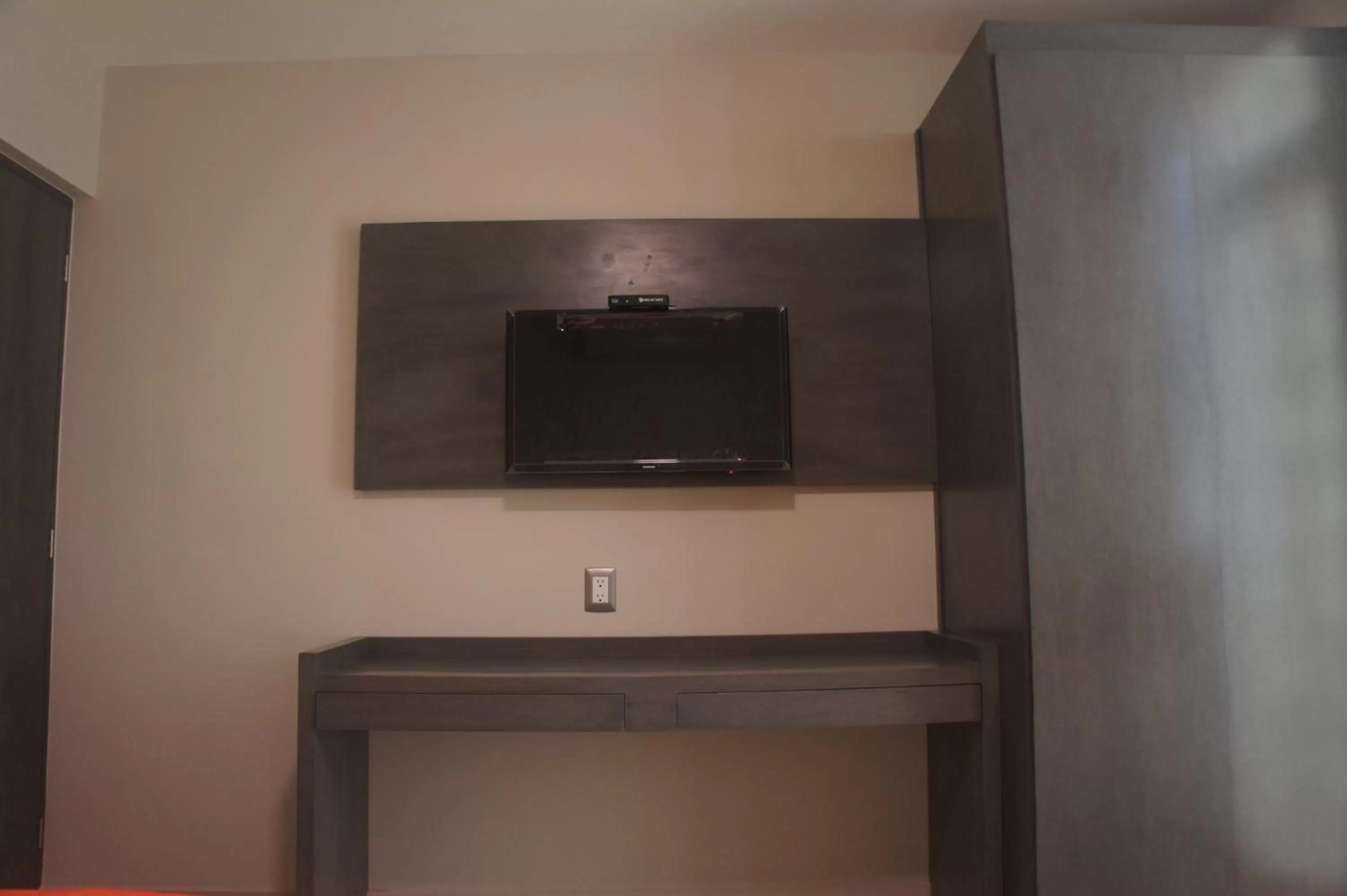 Bedroom, TV/Entertainment Center in Suites San Luis