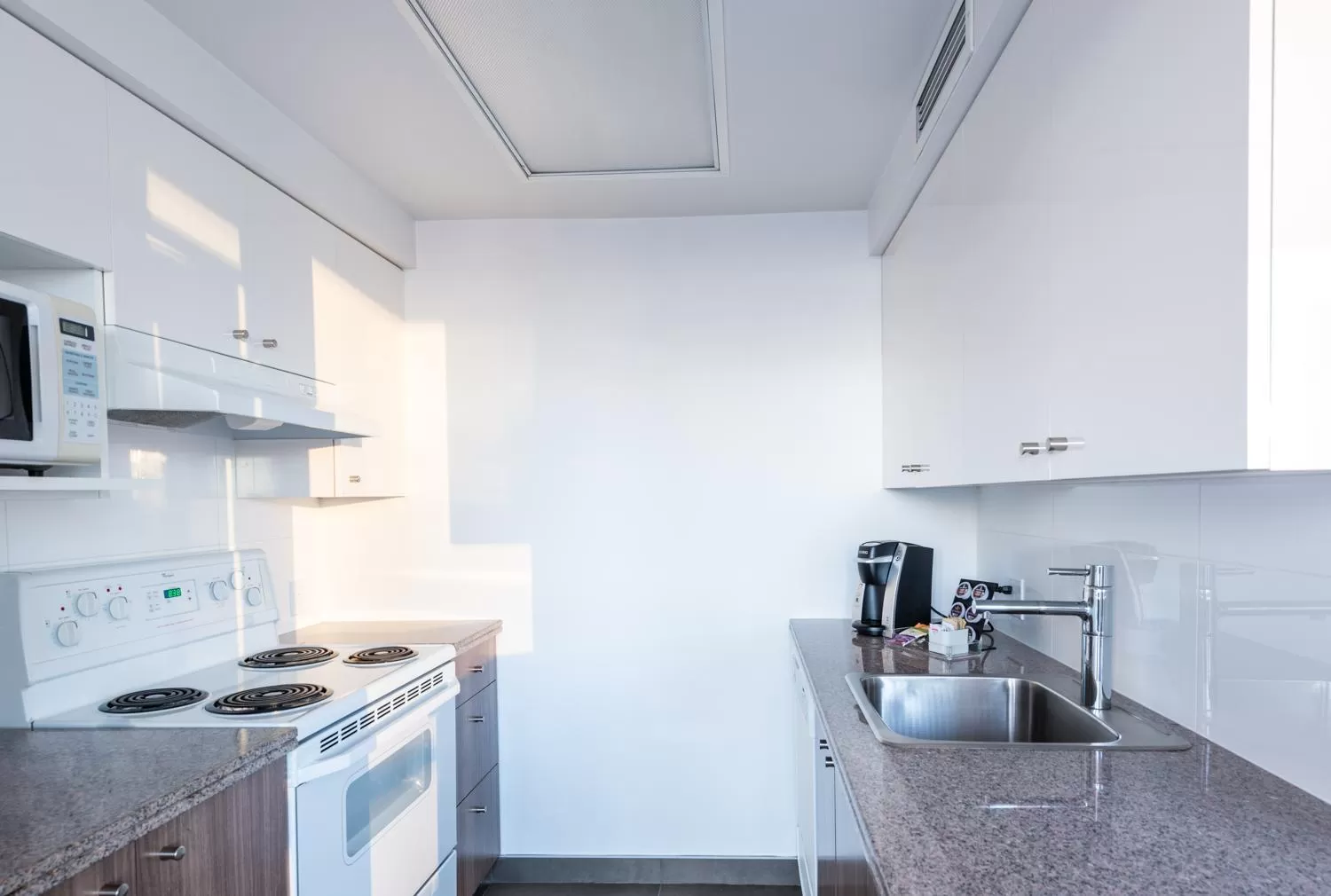 Kitchen or kitchenette in Carmana Hotel & Suites