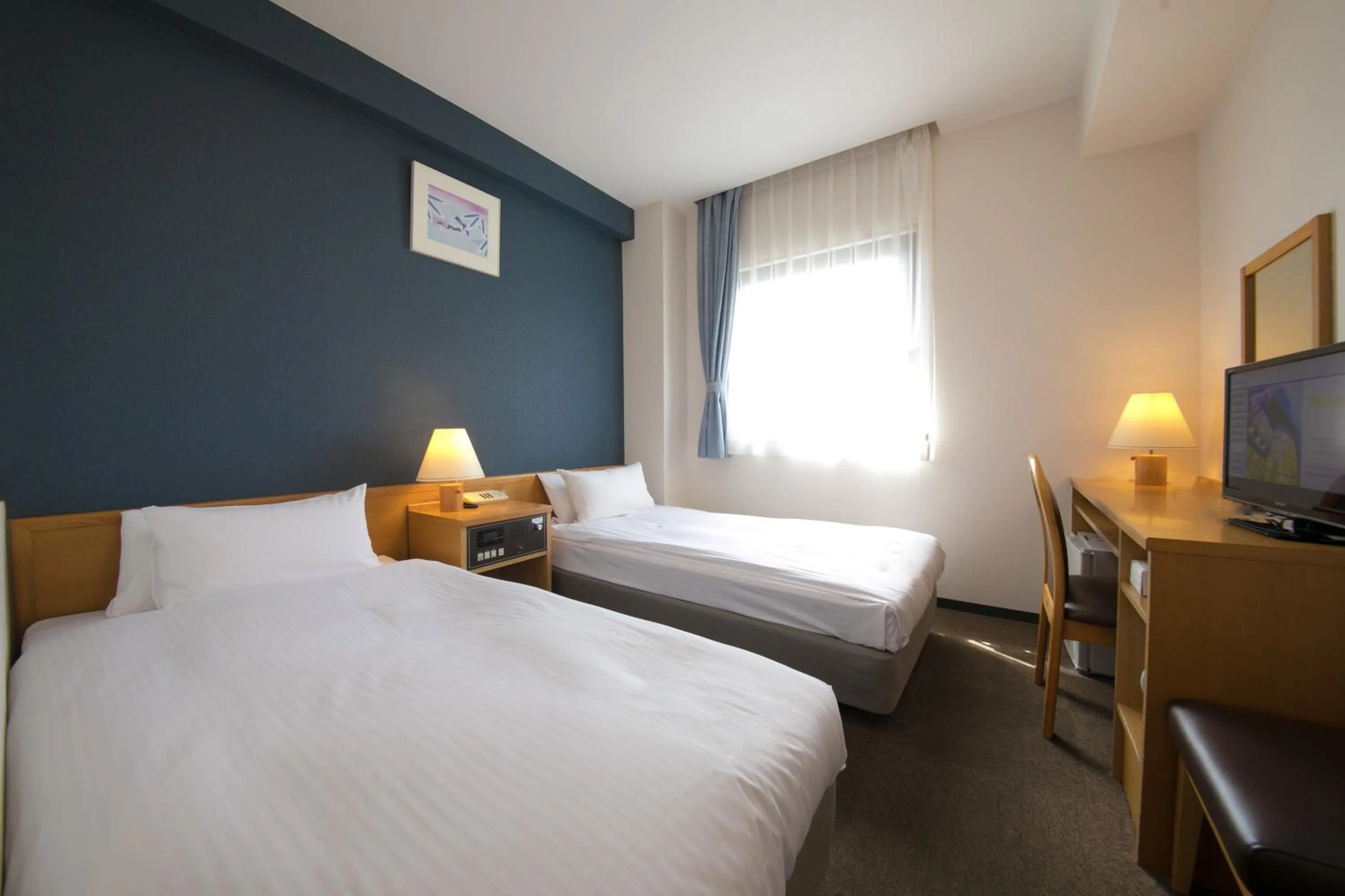 Bed in Heiwadai Hotel 5