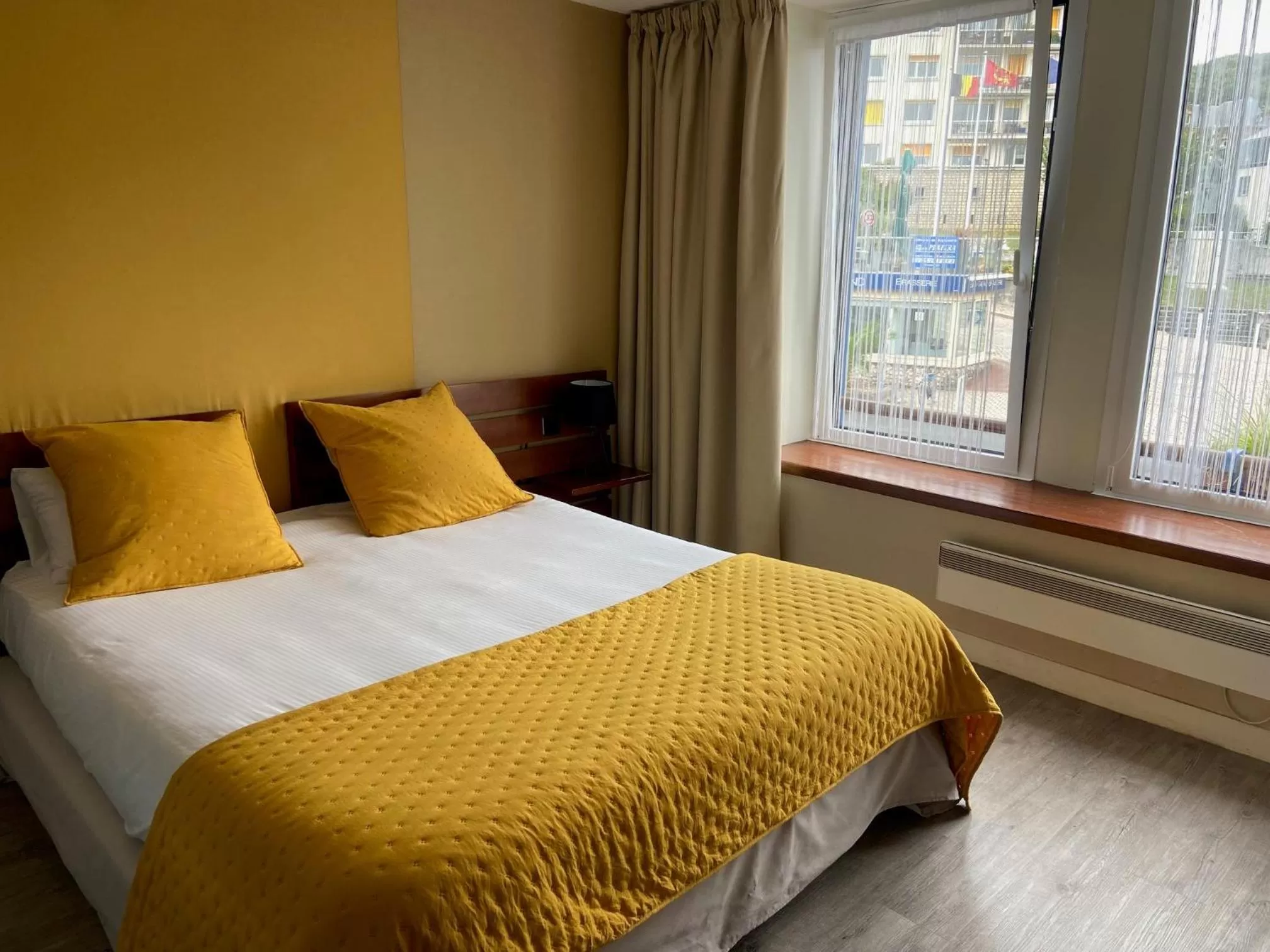 Bed in LOGIS HOTEL - La Petite Rade