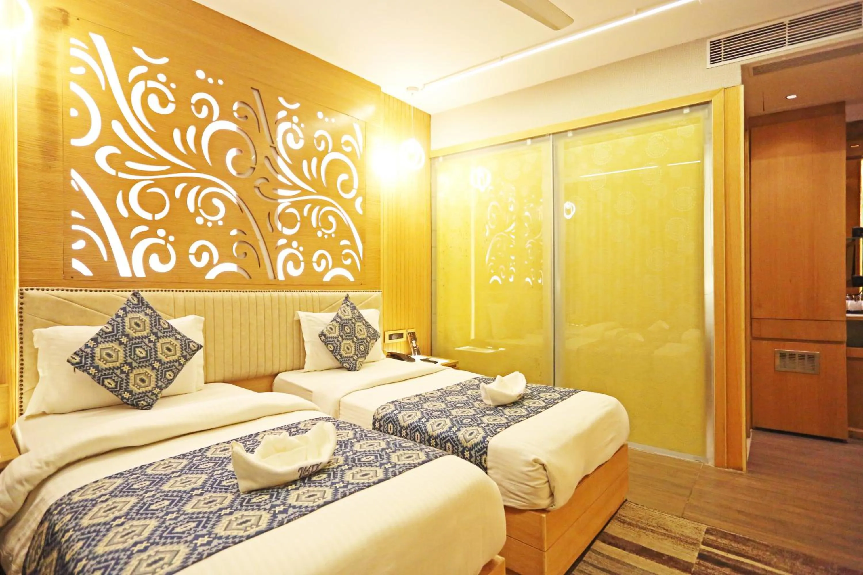 Bed in JRD Luxury-Business Hotel