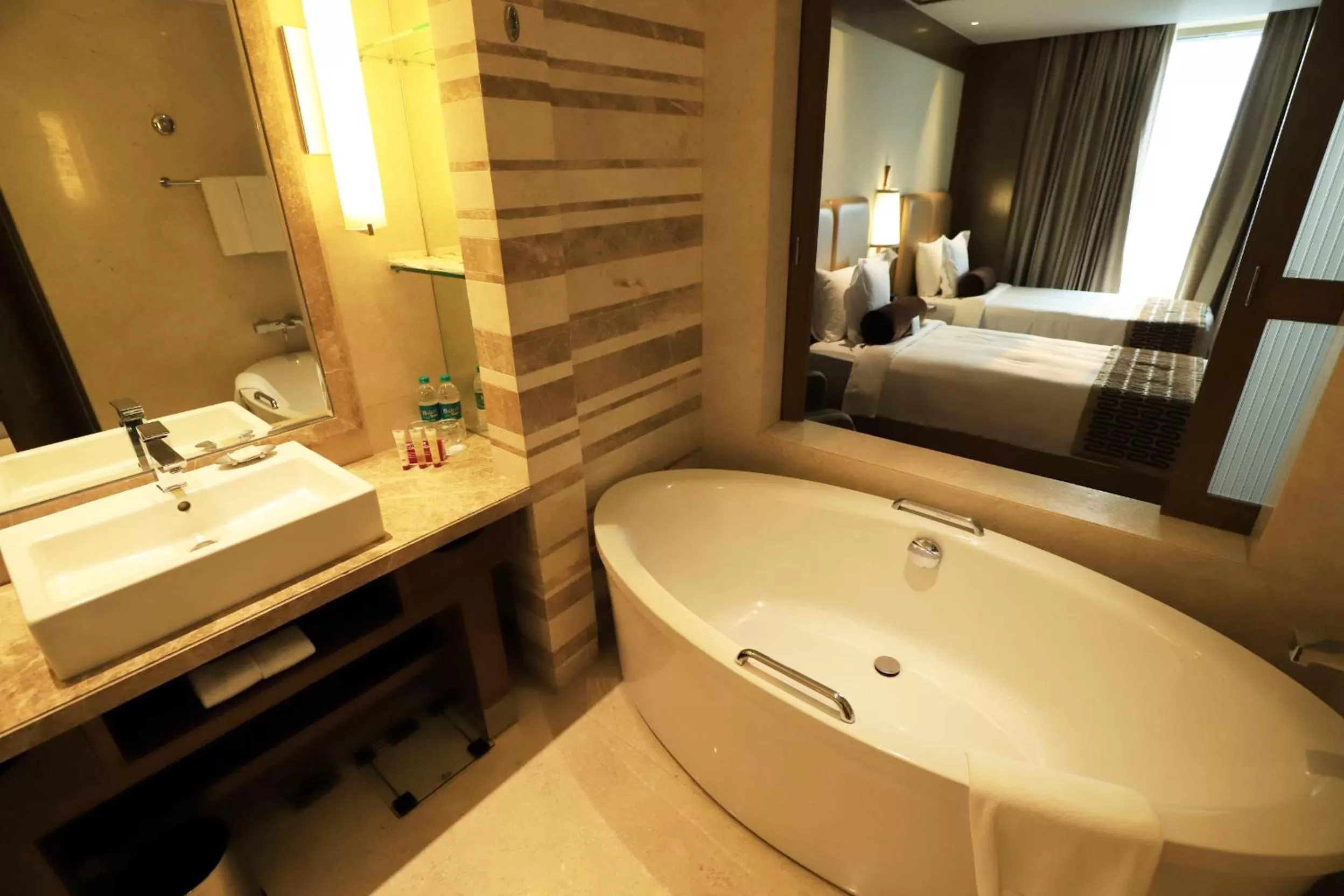 Bathroom, Bed in Crowne Plaza New Delhi Okhla by IHG