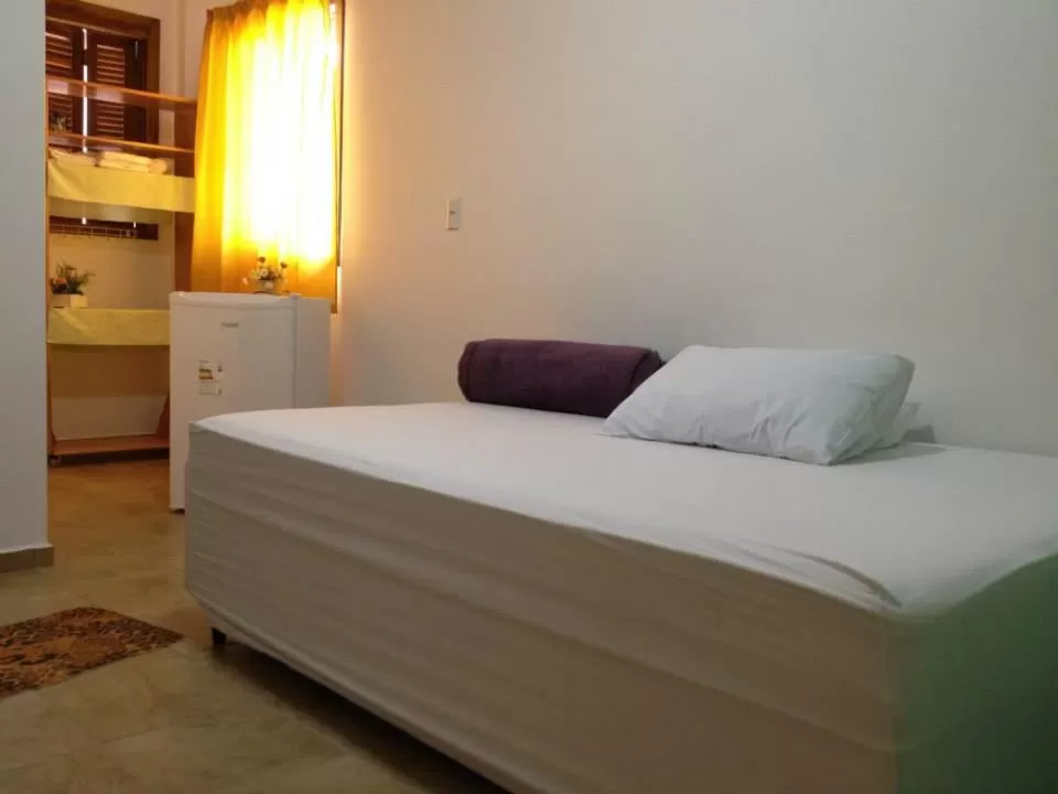 minibar, Bed in Hotel Pousada Rolantchê