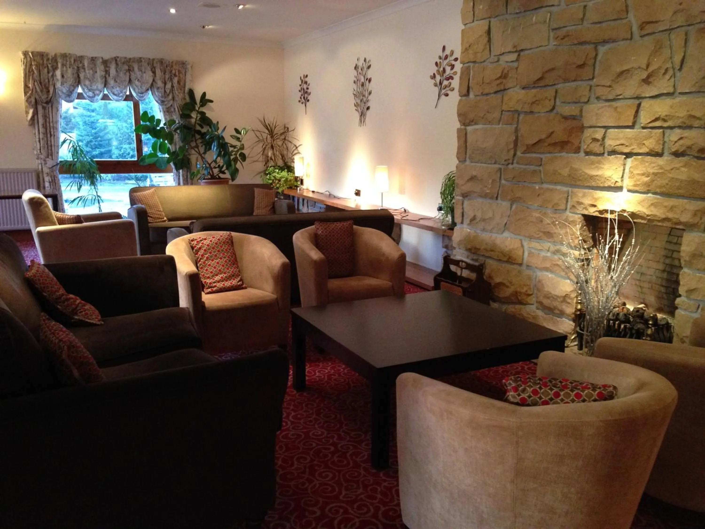 Communal lounge/ TV room in Highlander Hotel ‘A Bespoke Hotel’
