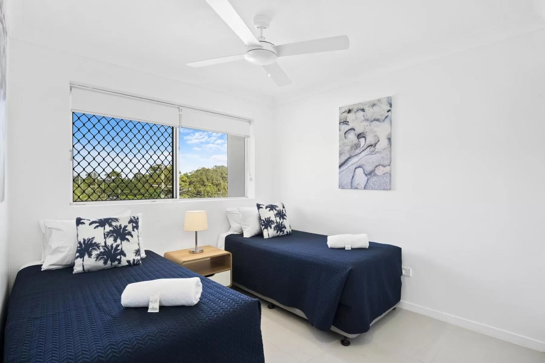 Bed in Kirra Palms Holiday Apartments