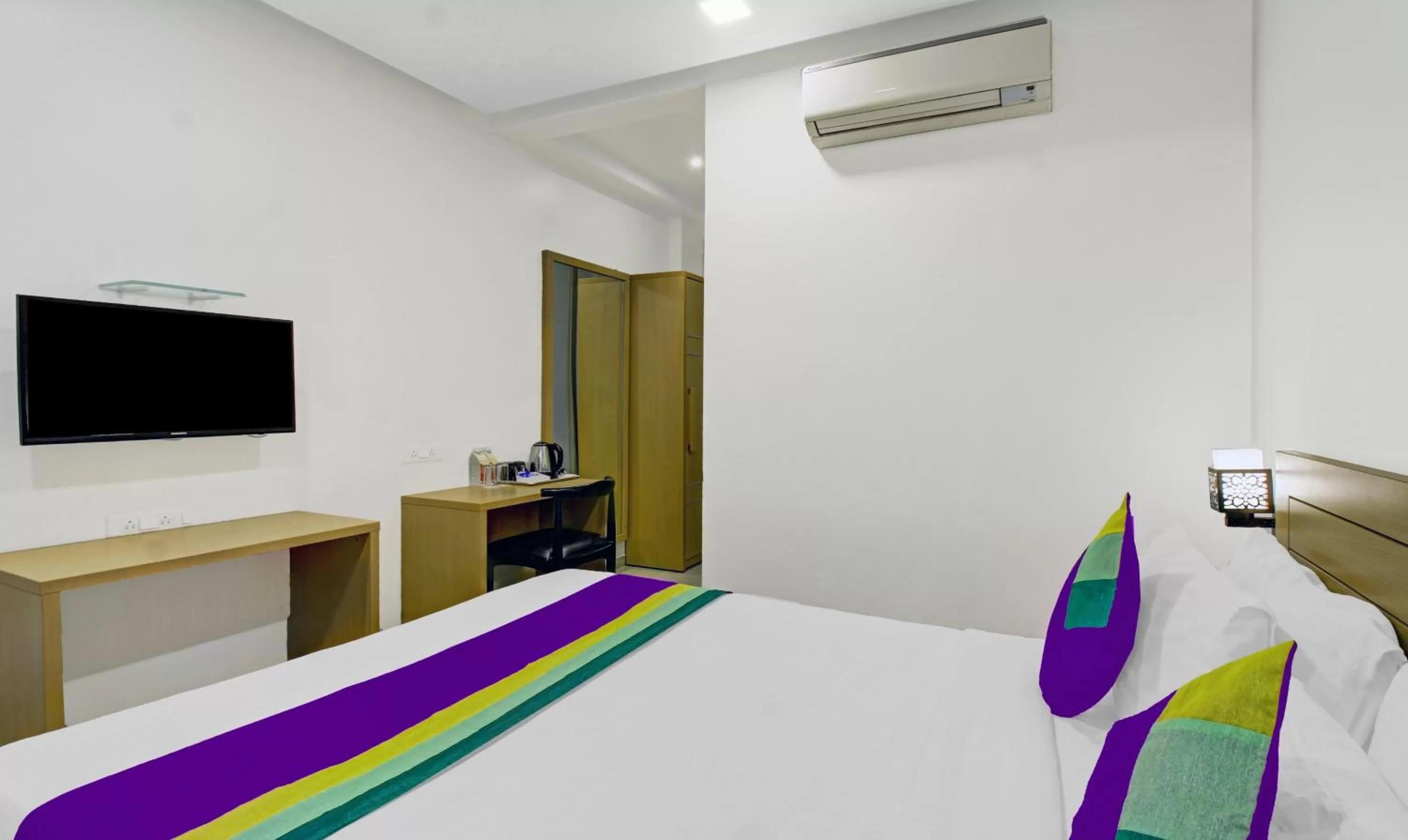 Bedroom, Bed in Treebo Premium Brijinn