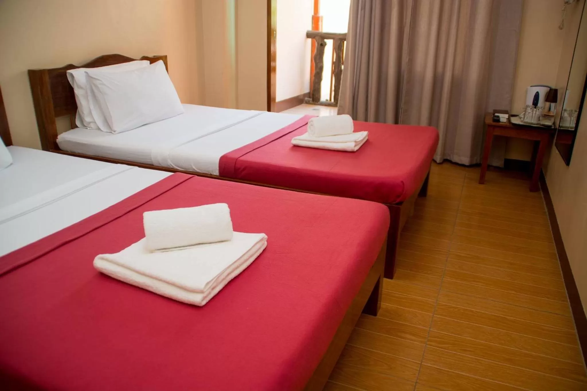 Bed in Jurias Garden Hotel