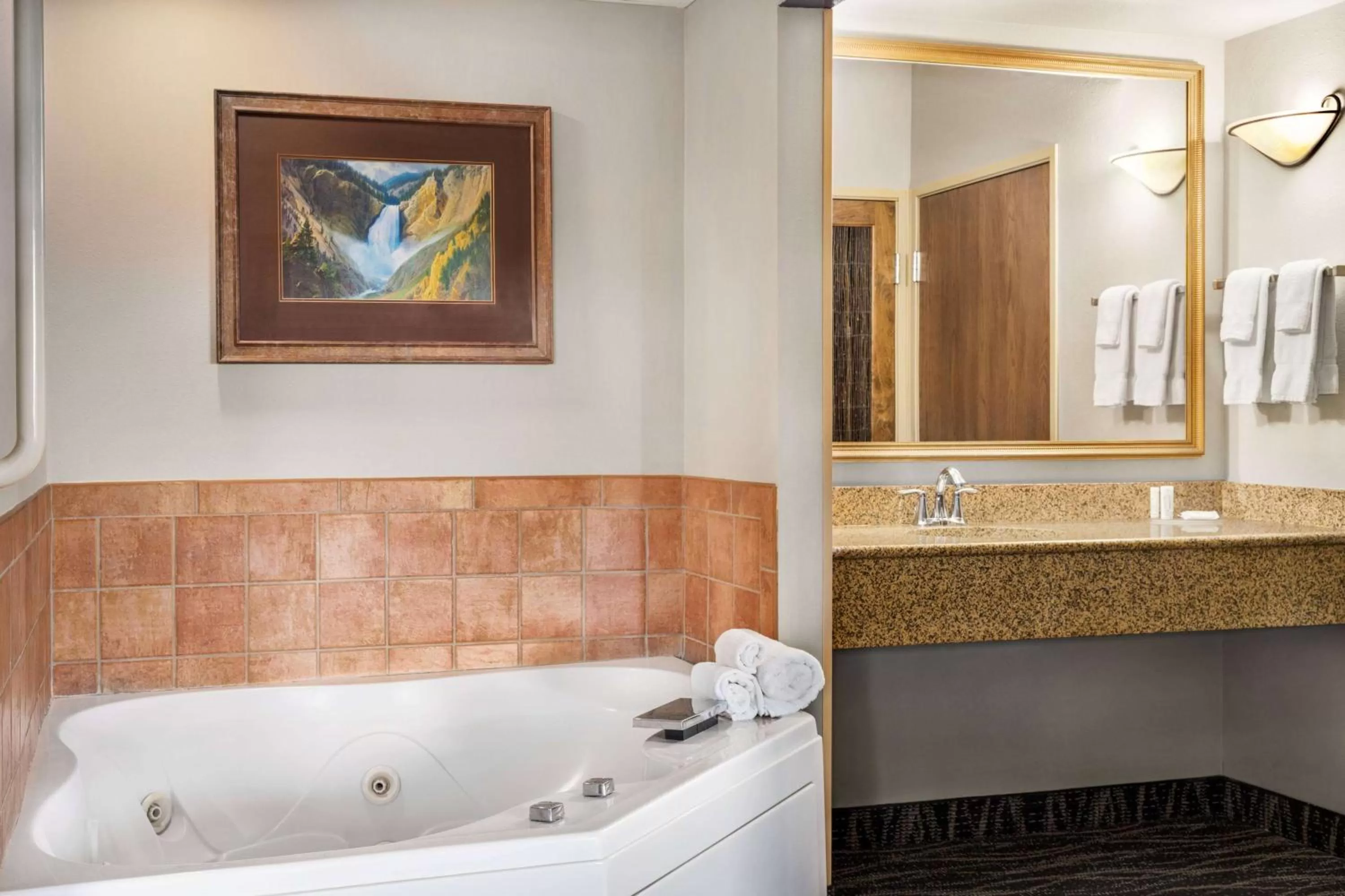 Bed in AmericInn by Wyndham Laramie Near University of Wyoming