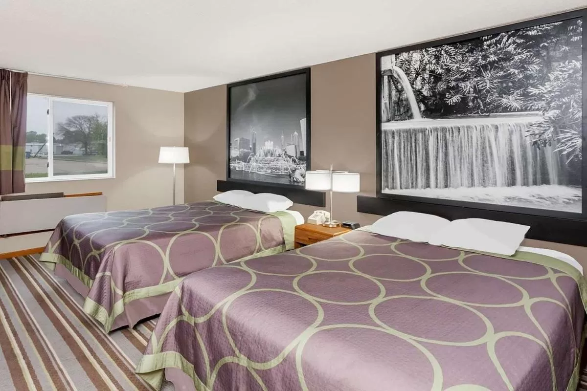 Bed in Super 8 by Wyndham Gilman