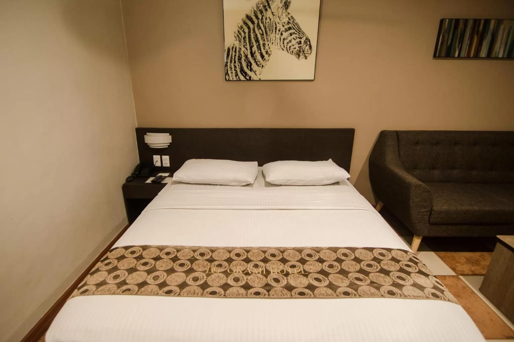 Bed in DG Grami Hotel