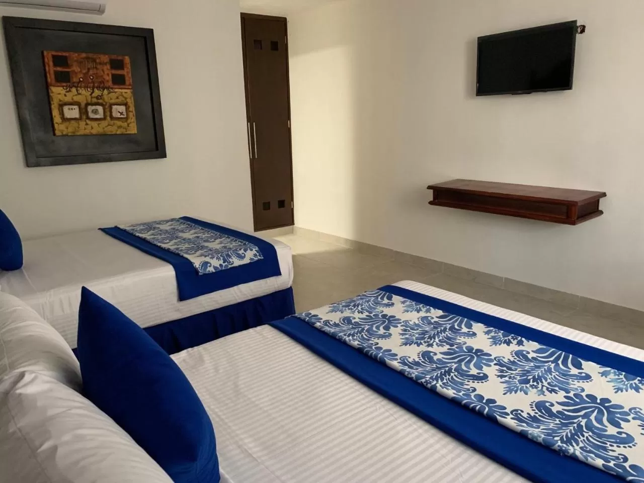 Bed in Hotel Catedral Valladolid Yucatan