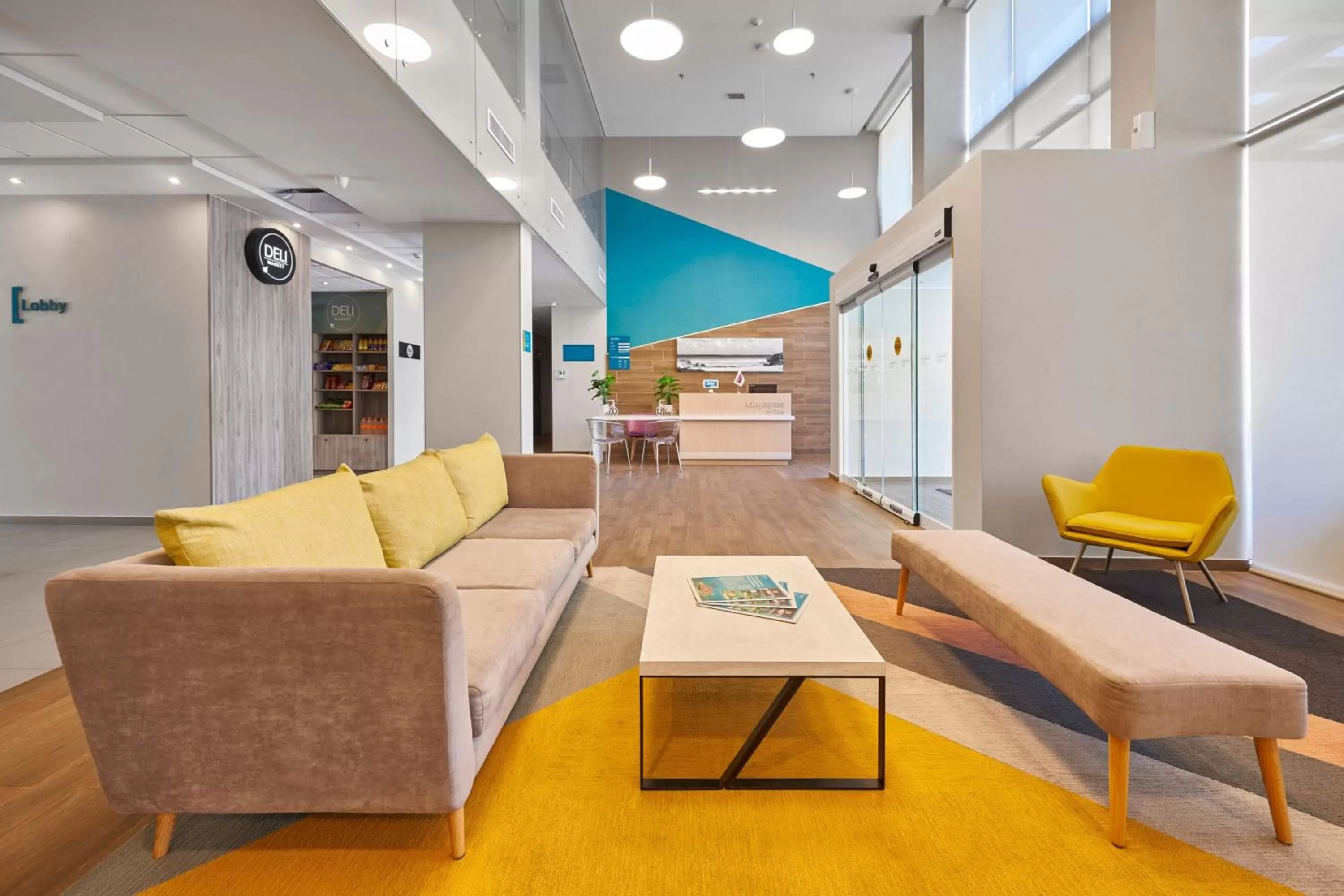 Lobby or reception in City Express Suites by Marriott Playa del Carmen