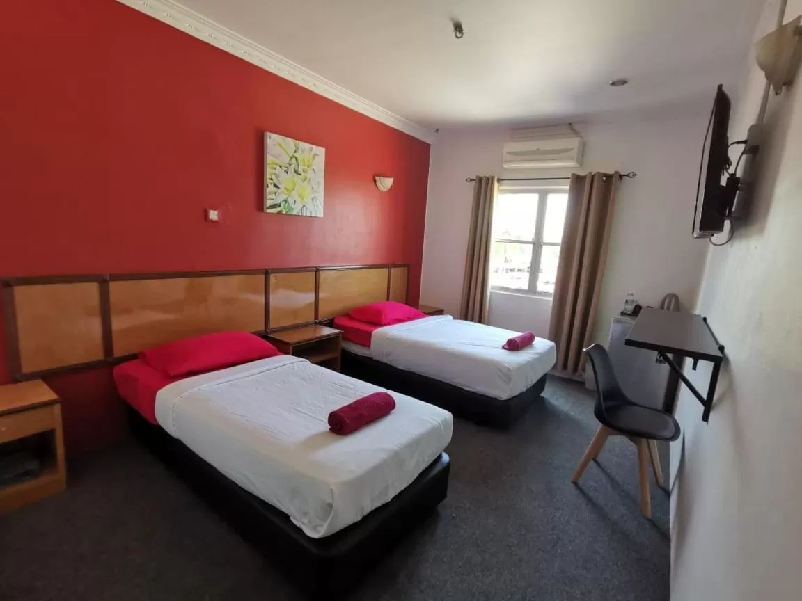 Bed in THE ZULEY HERITAGE HOTEL