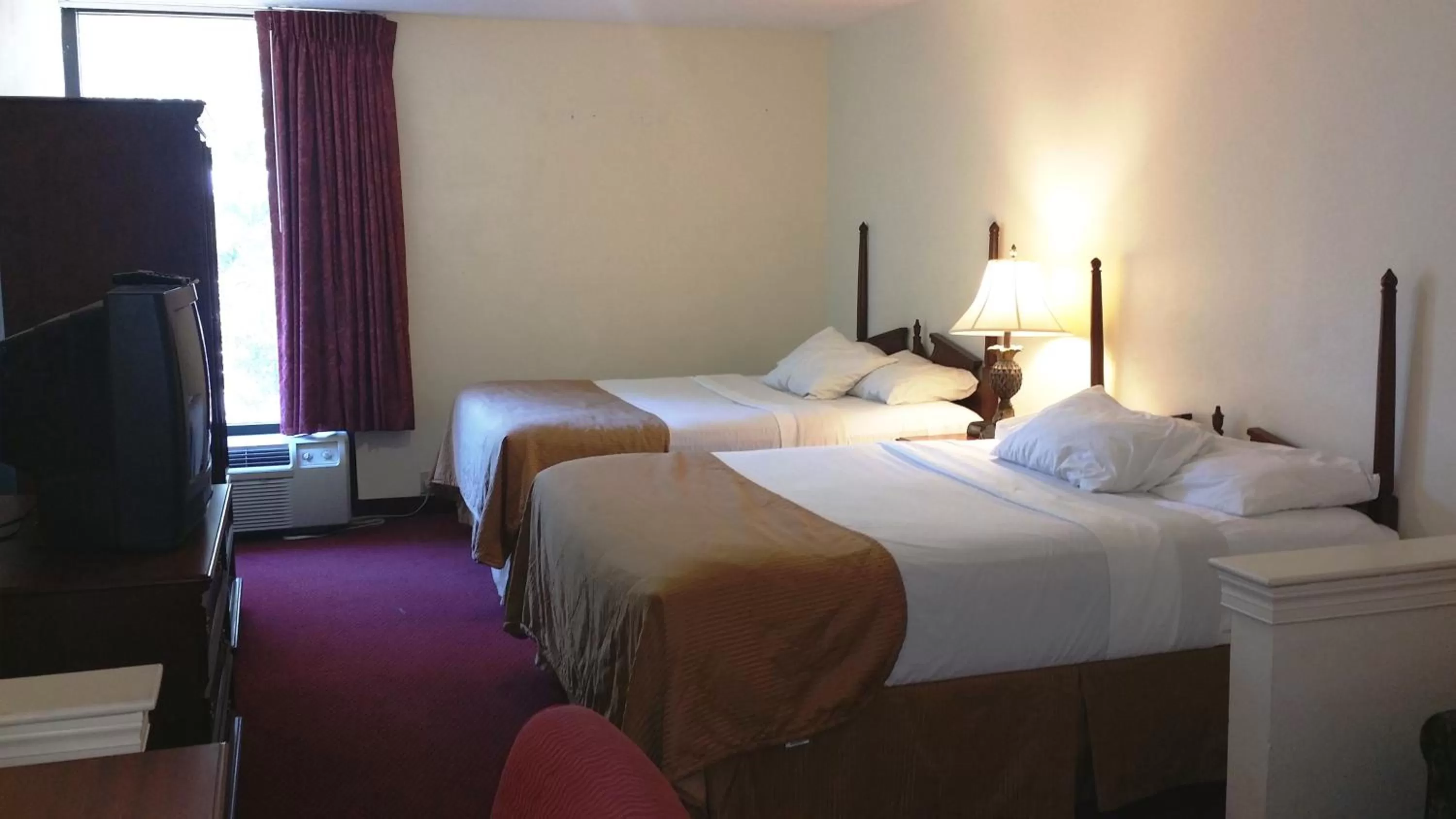 Bed in Opal Hotel & Suites