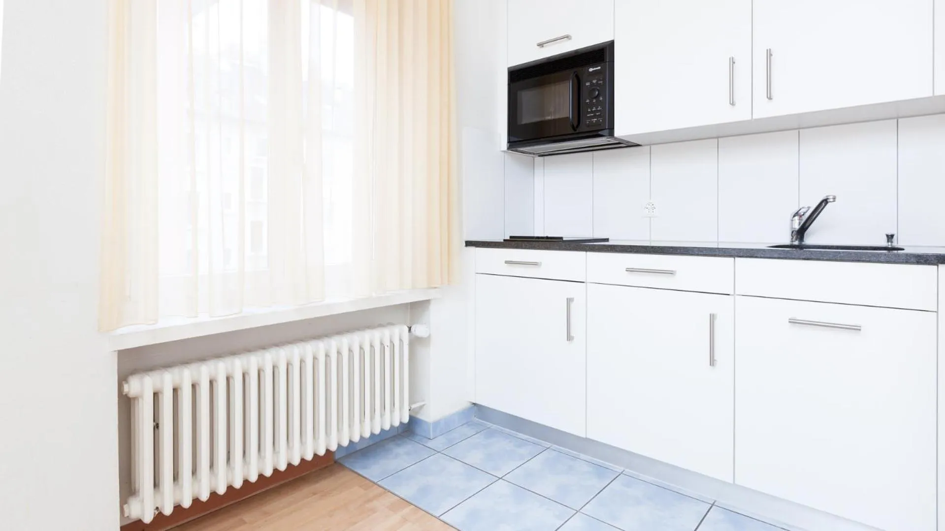 Kitchen or kitchenette in Swiss Star Zurich Sihlfeld - Self Check-In