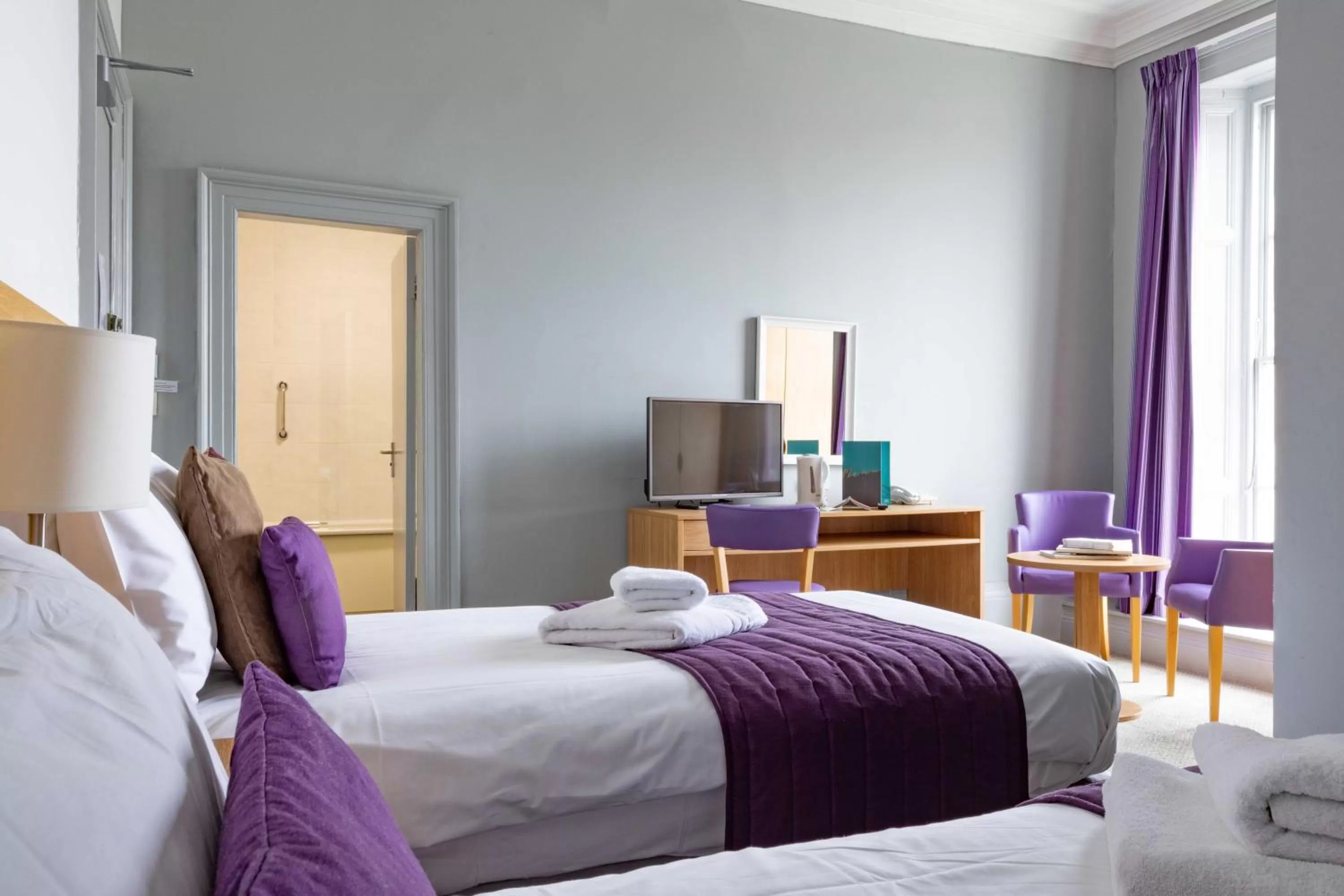 Bed in The Marine Hotel