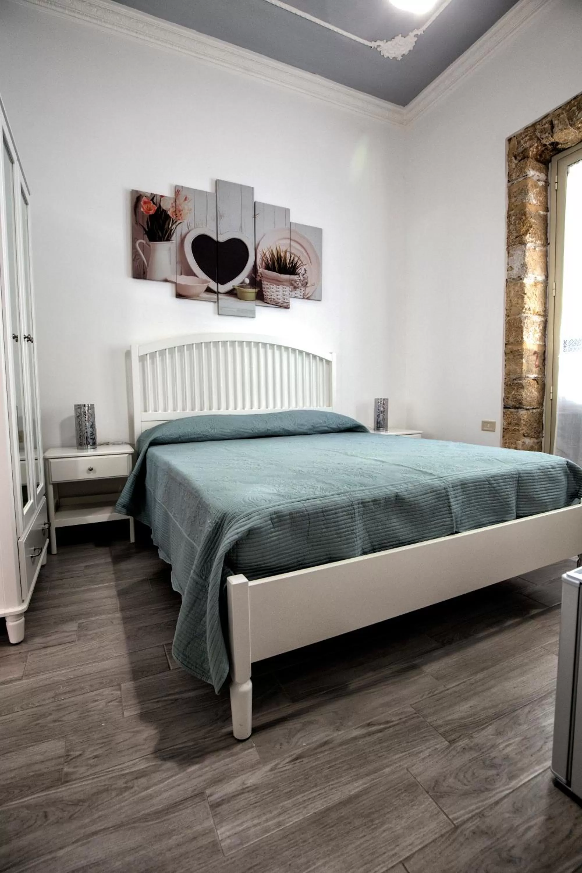 Bed in GARDEN HOUSE: APARTMENTS AND ROOMS FOR HOLIDAYS