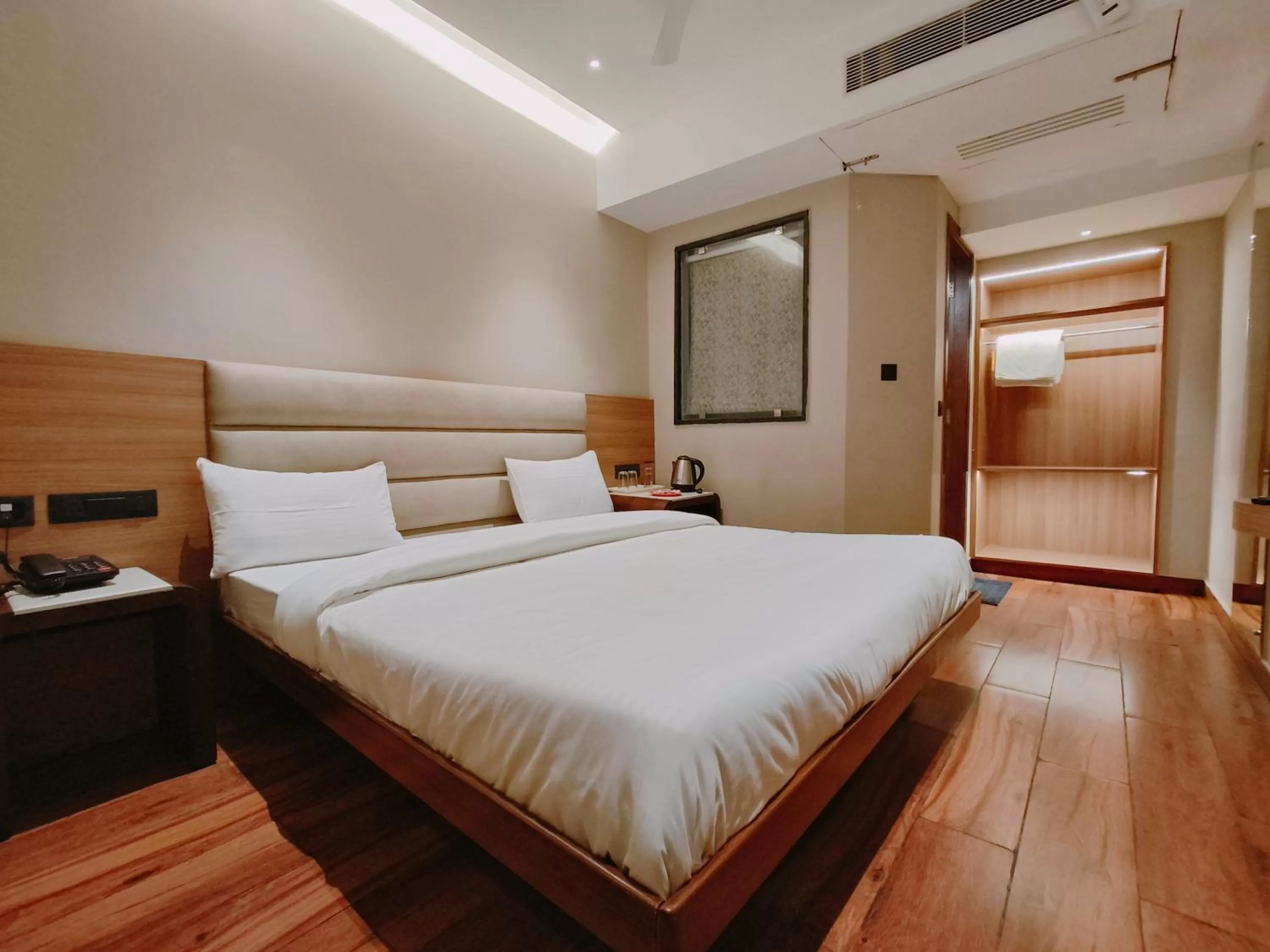 Bed in Aura Rooms