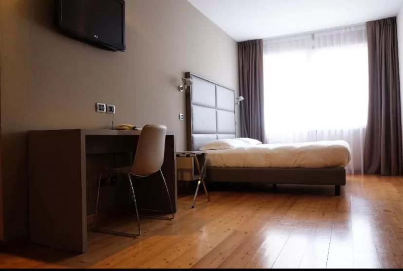 Bed in Hotel Rubicone