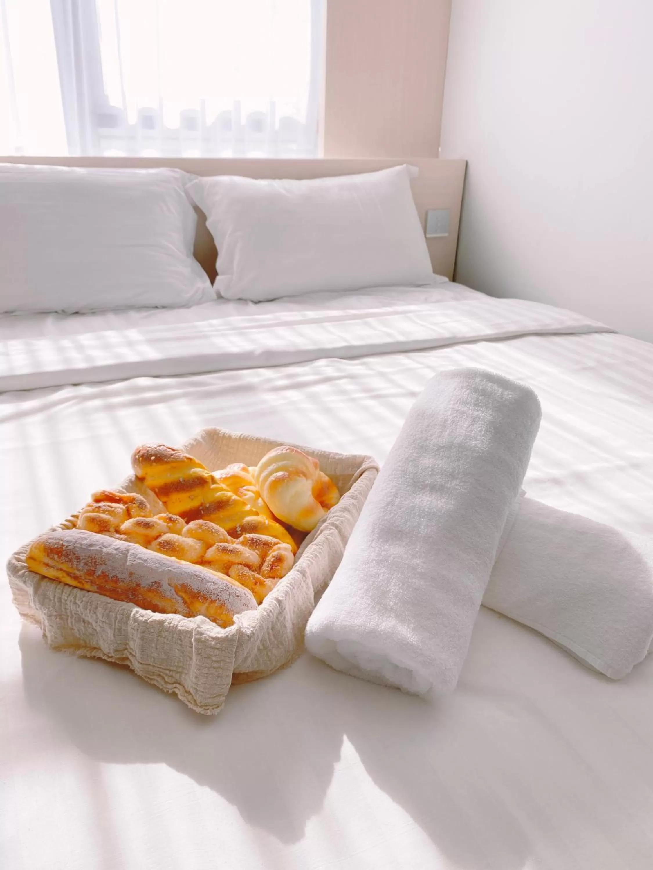 Bed in The Atelier Boutique Hotel