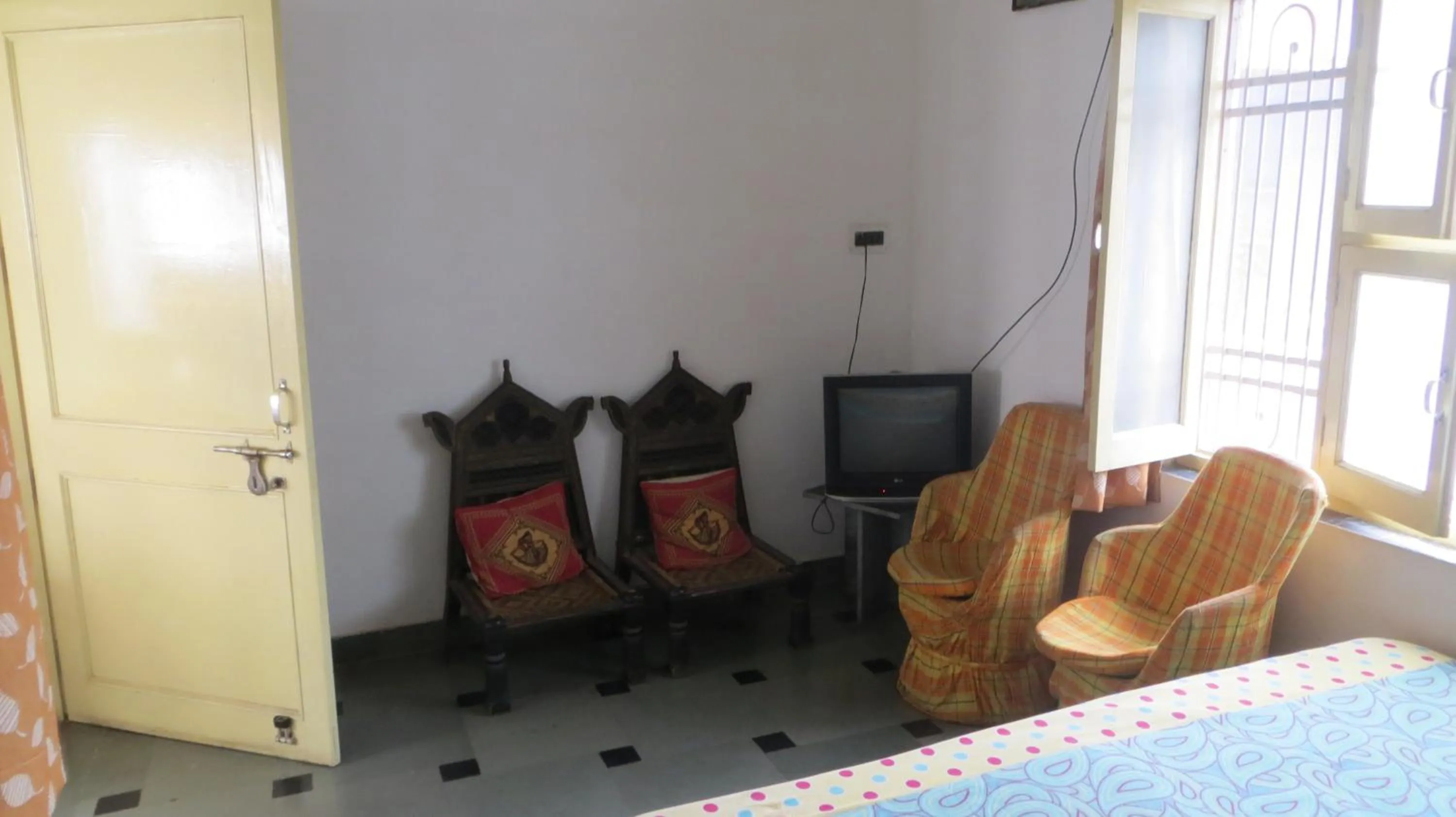 Seating area, Bed in Udai Haveli Guest House
