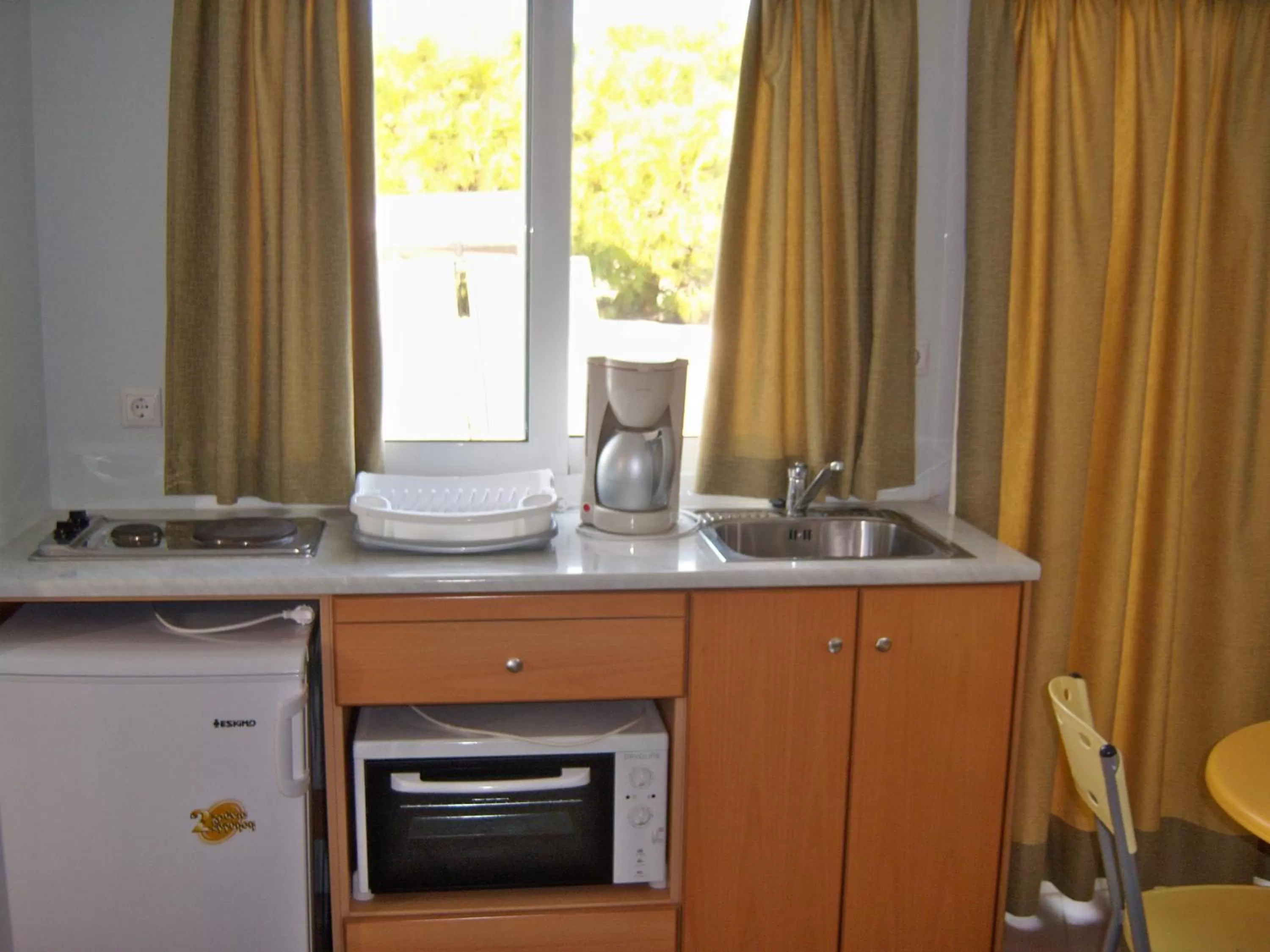 Kitchen or kitchenette in Fantasia Hotel Apartments