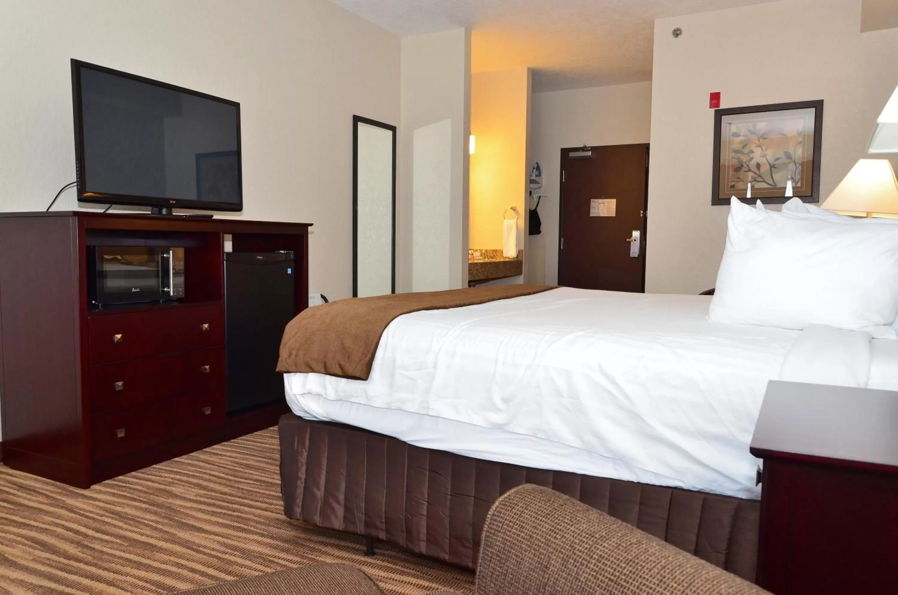 Bed in Cobblestone Inn & Suites - Clarion