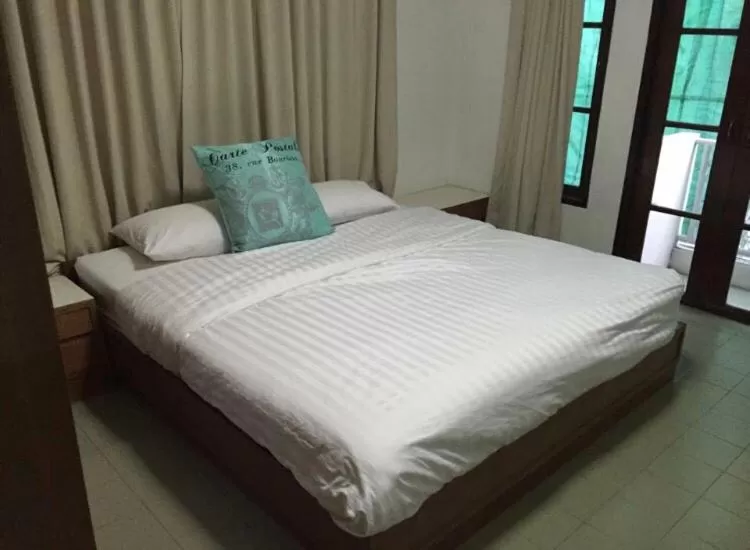 Bed in Oriental Smile Hotel