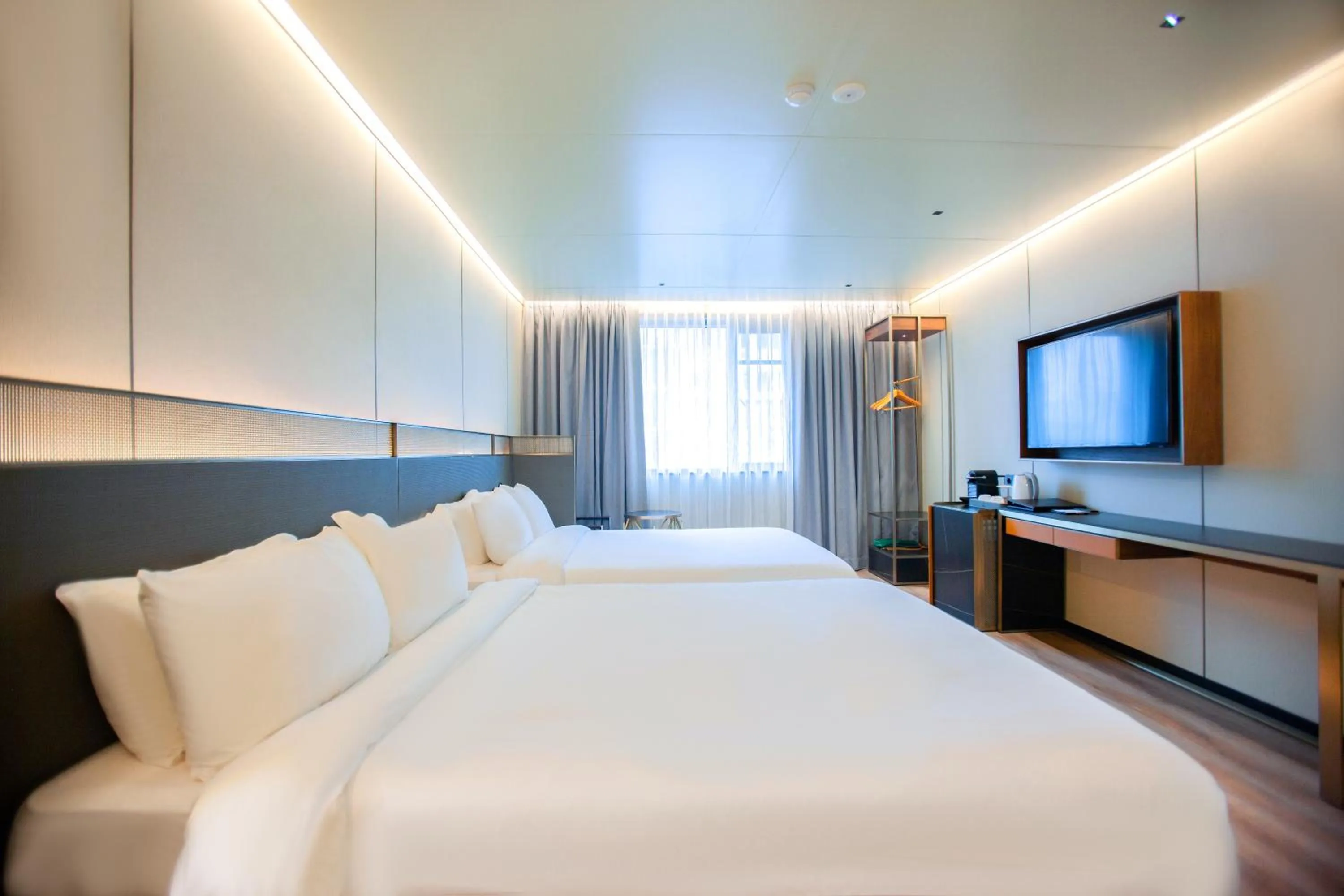 Bed in Amber Hotel Jeju